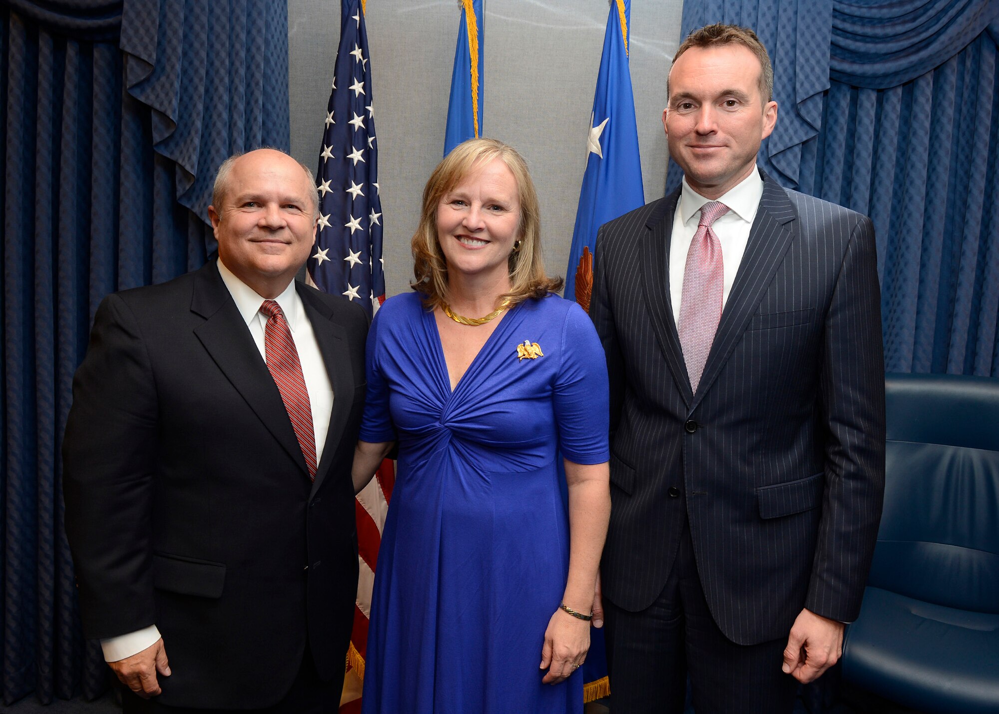 Acting Secretary of the Air Force Eric Fanning (right) congratulates retired Maj. Gen Charles Lyon and his wife, Karen, after presenting Lyon the Zuckert Management award during a Pentagon ceremony, Nov. 18, 2013.  The Zuckert Management Award is named after the seventh secretary of the Air Force and is presented annually to recognize outstanding top-level Air Force managers.  (U.S. Air Force photo/Scott M. Ash)
