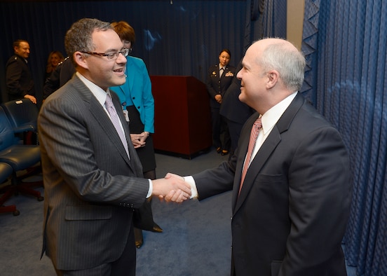 Daniel Ginsberg (left) congratulates retired Maj. Gen. Charles Lyon after Acting Secretary of the Air Force Eric Fanning presented Lyon the Zuckert Management award during a Pentagon ceremony, Nov. 18, 2013.  The Zuckert Management Award is named after the seventh secretary of the Air Force and is presented annually to recognize outstanding top-level Air Force managers. Ginsberg is the assistant secretary of the Air Force for Manpower and Reserves. (U.S. Air Force photo/Scott M. Ash)