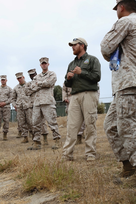 Jonathon Taylor, counter improvised explosive device instructor, talks to Marines and sailors about IED indicators and different types of IEDs during the counter IED calss given as part of the Predeployment Training Program.  The counter IED instructors taught inside the classroom for a portion of their class and then took the Marines and sailors outside to show them certain indicators and where to look for IEDs while in Aghanistan.