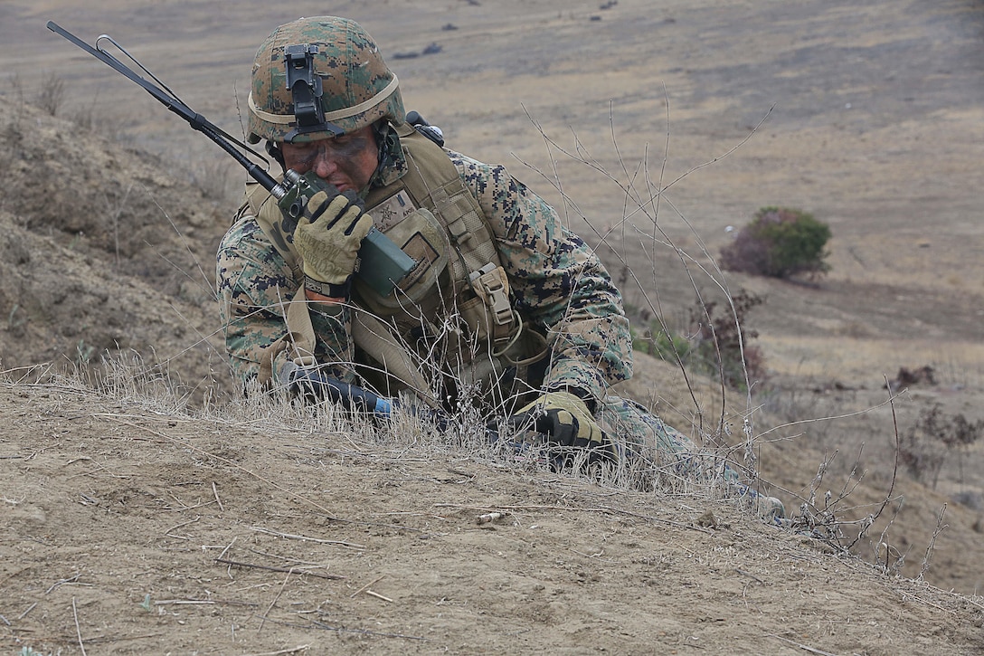 1st Lt. Albert Nowicki communicates with the other elements that are moving on Range 706 during the live-fire exercise for the Advanced Infantryman Course on Nov. 19. Range 706 is a combined arms range that includes mortars, machine guns, demolitions, breach clearing, and fire and movement. 

The Advanced Infantryman Course provides infantry qualified Marines with the training necessary to become a successful infantry squad leader, the course teaches each infantryman proper patrolling techniques, urban combat tactics, defensive tactics and offensive tactics as a squad leader. 