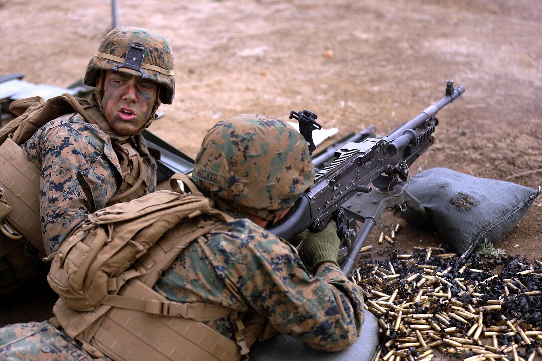 Lance Cpl. Cody Countryman repeats commands to the squad leader while his gunner Pfc. Colton Welker suppresses targets downrange on Range 706 for the Advanced Infantryman Course on Nov. 19. Range 706 is a combined arms range that includes mortars, machine guns, demolitions, breach clearing, and fire and movement. 

The Advanced Infantryman Course provides infantry qualified Marines with the training necessary to become a successful infantry squad leader, the course teaches each infantryman proper patrolling techniques, urban combat tactics, defensive tactics and offensive tactics as a squad leader. 