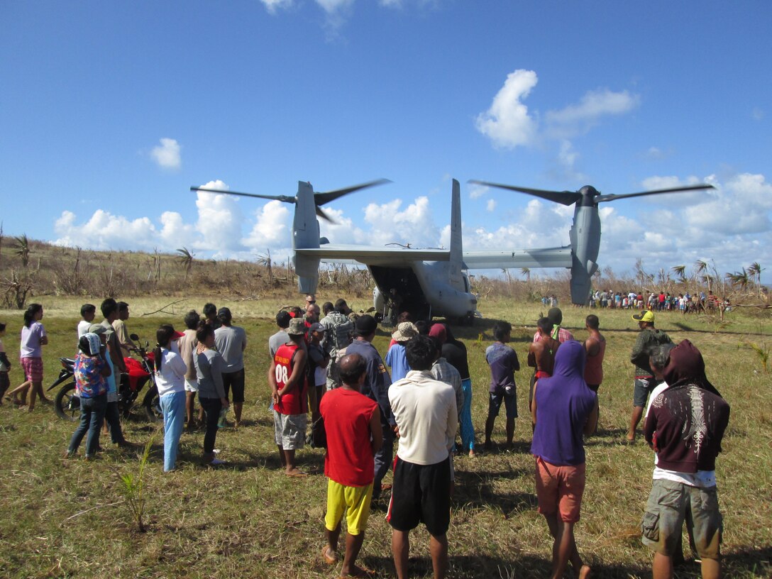 A bilateral assessment team, composed of U.S. Marines, Philippine Department of Social Welfare and Development, and members of the Armed Forces of the Philippines, delivers U.S. Agency for International Development relief supplies from an MV-22 Osprey tiltrotor aircraft, Nov. 18. The team landed to determine needs and deliver relief to remote areas in and near Leyte to assess the needs of people isolated by Typhoon Haiyan. U.S. military assets have delivered relief supplies provided by the U.S. Agency for International Development since the start of Operation Damayan, in support of the Government of the Philippines in the wake of Typhoon Haiyan.