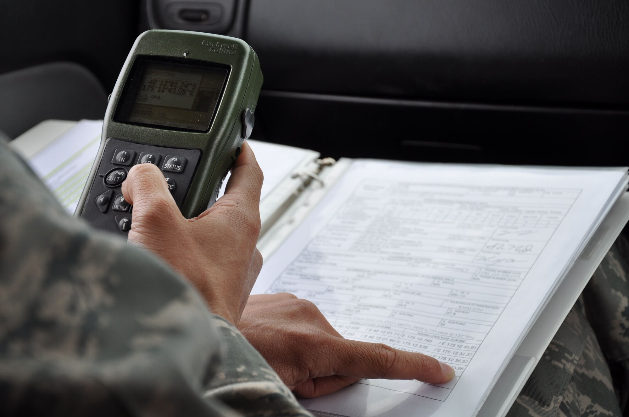 OHAKEA, New Zealand -- United States Air Force Maj. Corey Akiyama GPS compares coordinates from the drop-zone survey report with his handheld GPS at a designated drop zone Nov. 14 at the New Zealand Defence Force Raumi Drop Zone near Ohakea, New Zealand.  Kiwi Flag personnel are supporting Exercise Southern Katipo held on New Zealand’s South Island by managing air operations and providing cargo and passenger airlift including tactical air drops to SK participants. SK hosts nine countries involved in air, land and maritime operations. (U.S. Air Force photo by Senior Master Sgt. Denise Johnson)