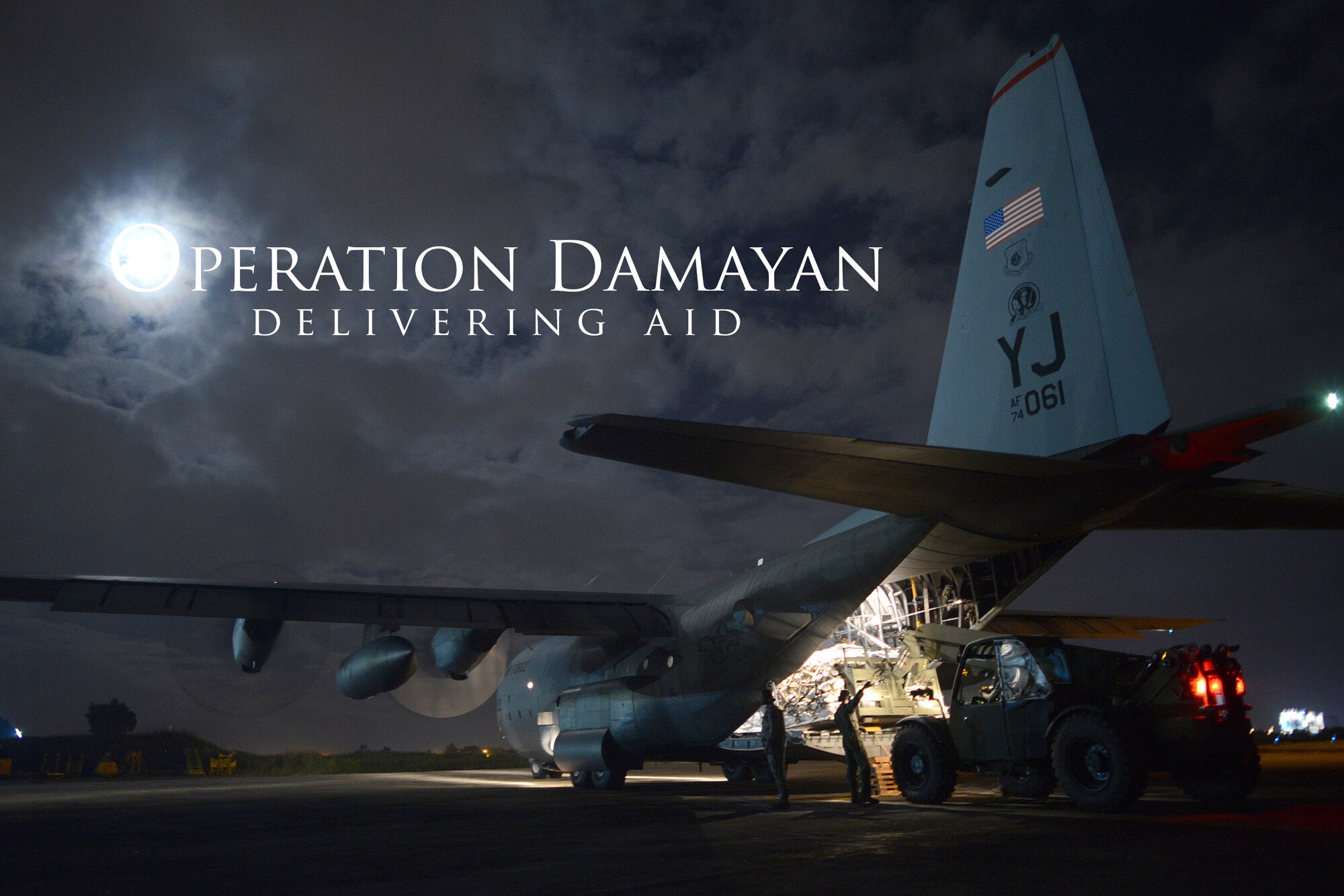 Airmen and Marines load humanitarian aid onto a C-130H aircraft during Operation Damayan at Villamor Air Base, Republic of the Philippines, Nov. 18, 2013. Operation Damayan is a humanitarian aid and disaster relief operation led by the Philippine government and supported by a multinational response force. (U.S. Air Force photo graphic by 2nd Lt. Jake Bailey/Released)