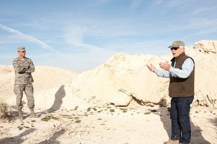 Col. Barry Cornish, 99th Air Base Wing commander, listens to a presentation given by University of Nevada, Las Vegas geology professor Dr. Stephen M. Rowland Nov. 18, 2013, at Tule Springs in Las Vegas. Cornish, along with other 99th ABW leaders, took a tour of Tule Springs to show support for a new bill that would make the fossil beds America’s newest national monument. (U.S. Air Force photo by Airman 1st Class Joshua Kleinholz)
