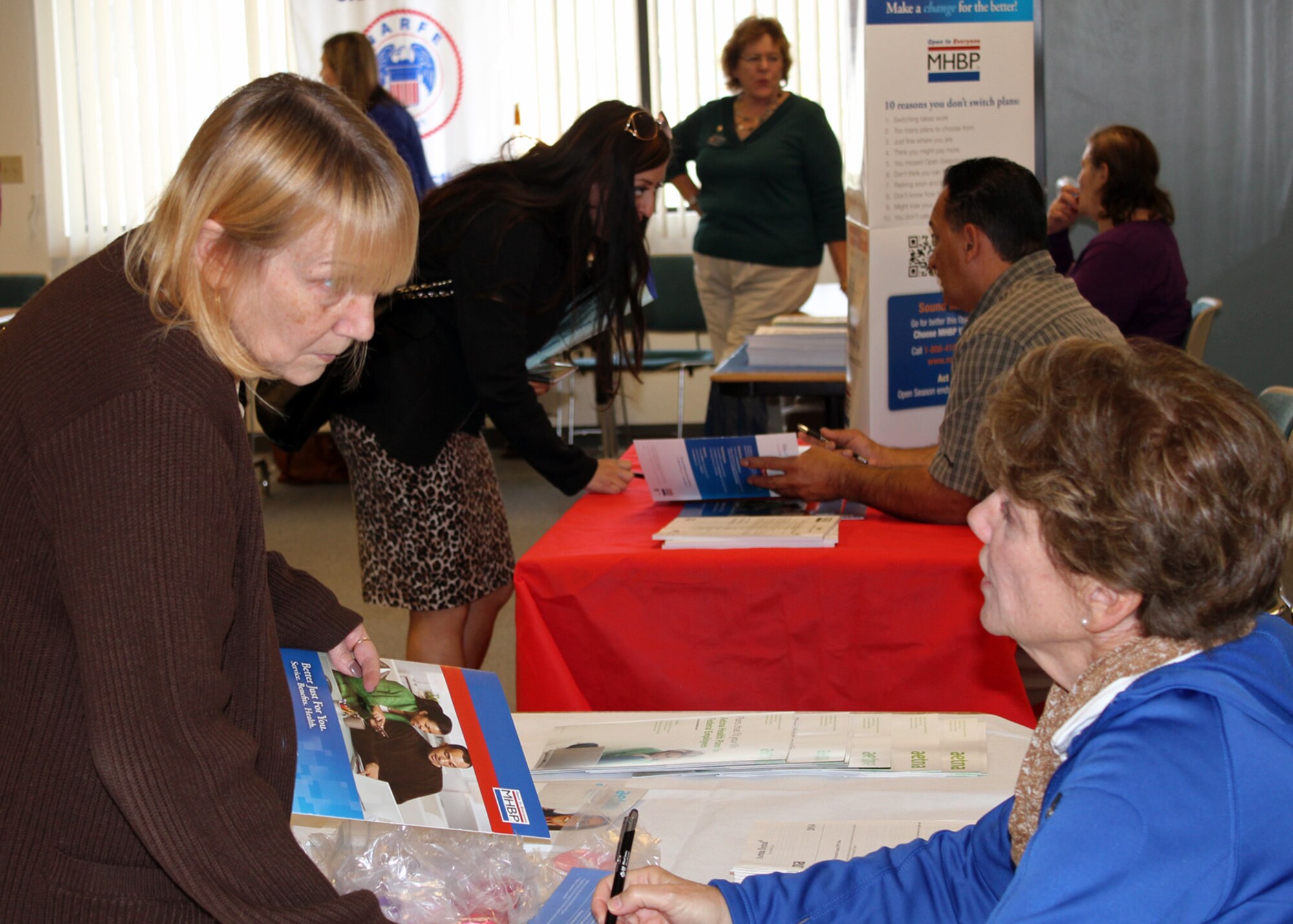 VANDENBERG AIR FORCE BASE, Calif. -- Tammy Martin, a Vandenberg AFB federal employee, talks with health insurance company representative Janice Abercrombie about current health care plan options during a health fair event here Monday, Nov. 18. (Courtesy photo)