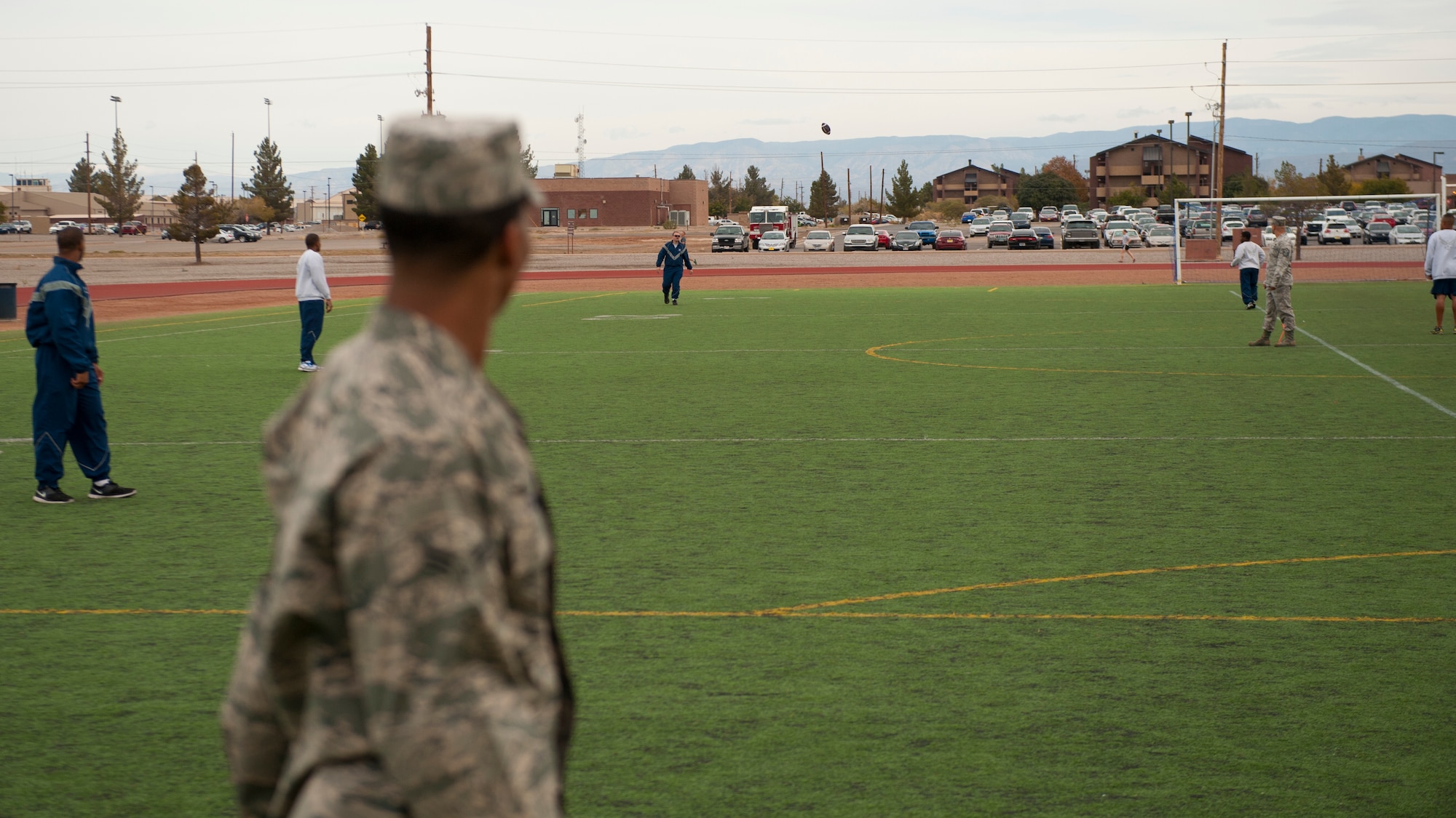 A member of Team Holloman competes in the football long throw contest as part of Sports Day at Holloman Air Force Base, N.M., Nov. 15. Sports Day is an annual event held through the Domenici Fitness and Sports Center, in which Holloman units to compete against one another in various team and individual events. (U.S. Air Force photo by Airman 1st Class Aaron Montoya/Released)