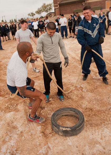 Members of Team Holloman prepare to compete in the tug-of-war tournament as part of Sports Day at Holloman Air Force Base, N.M., Nov. 15. Sports Day is an annual event held through the Domenici Fitness and Sports Center, in which Holloman units to compete against one another in various team and individual events. (U.S. Air Force photo by Airman 1st Class Aaron Montoya/Released)