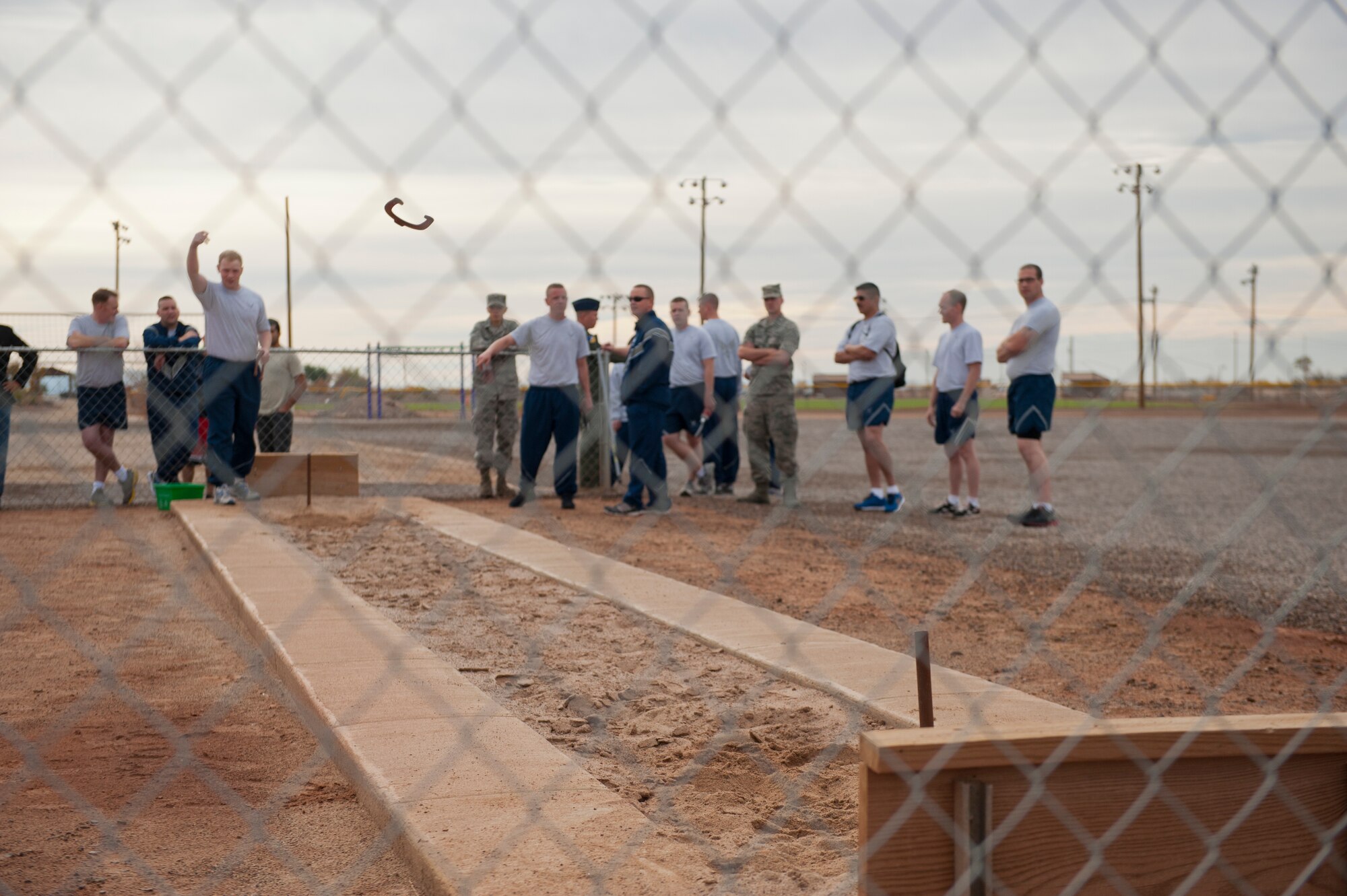Members of Team Holloman compete in a doubles horseshoe tournament as part of Sports Day at Holloman Air Force Base, N.M., Nov. 15. Sports Day is an annual event held through the Domenici Fitness and Sports Center, in which Holloman units to compete against one another in various team and individual events. (U.S. Air Force photo by Airman 1st Class Aaron Montoya/Released)