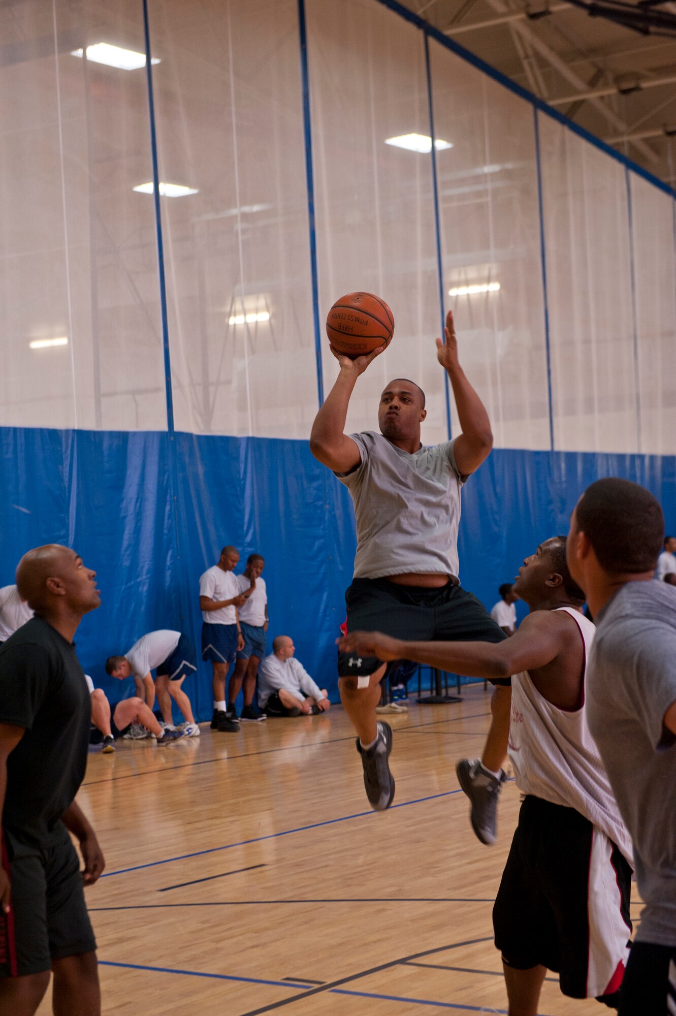 A member of Team Holloman shoots the ball in a basketball game during a Sports Day game at Holloman Air Force Base, N.M., Nov. 15. Sports Day is an annual event held through the Domenici Fitness and Sports Center, in which Holloman units to compete against one another in various team and individual events. (U.S. Air Force photo by Airman 1st Class Aaron Montoya/Released)