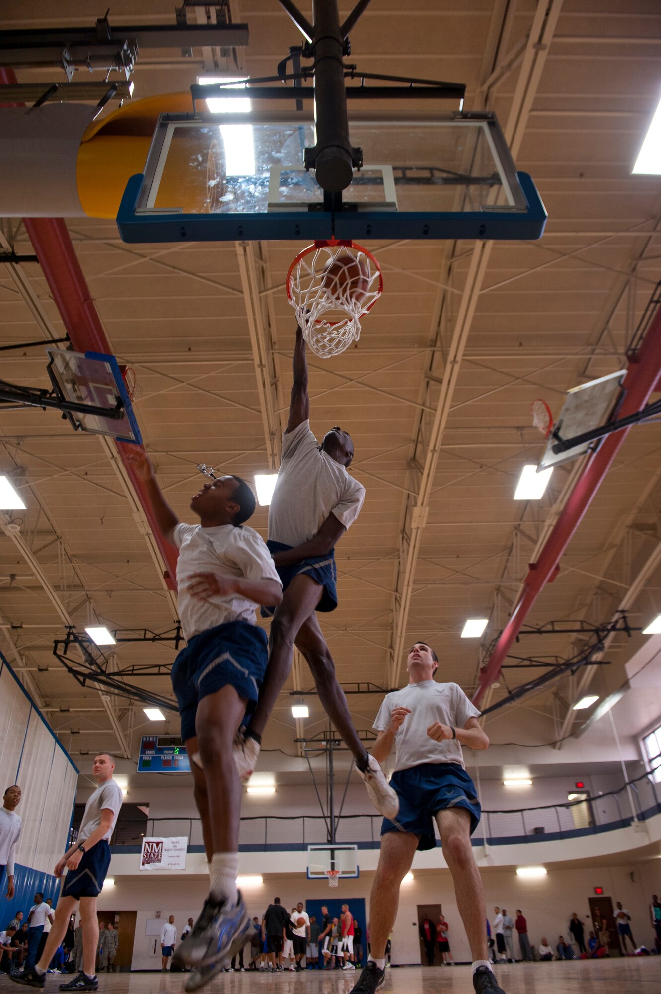 A member of Team Holloman dunks the ball in a basketball game during a Sports Day game at Holloman Air Force Base, N.M., Nov. 15. Sports Day is an annual event held through the Domenici Fitness and Sports Center, in which Holloman units to compete against one another in various team and individual events. (U.S. Air Force photo by Airman 1st Class Aaron Montoya/Released)
