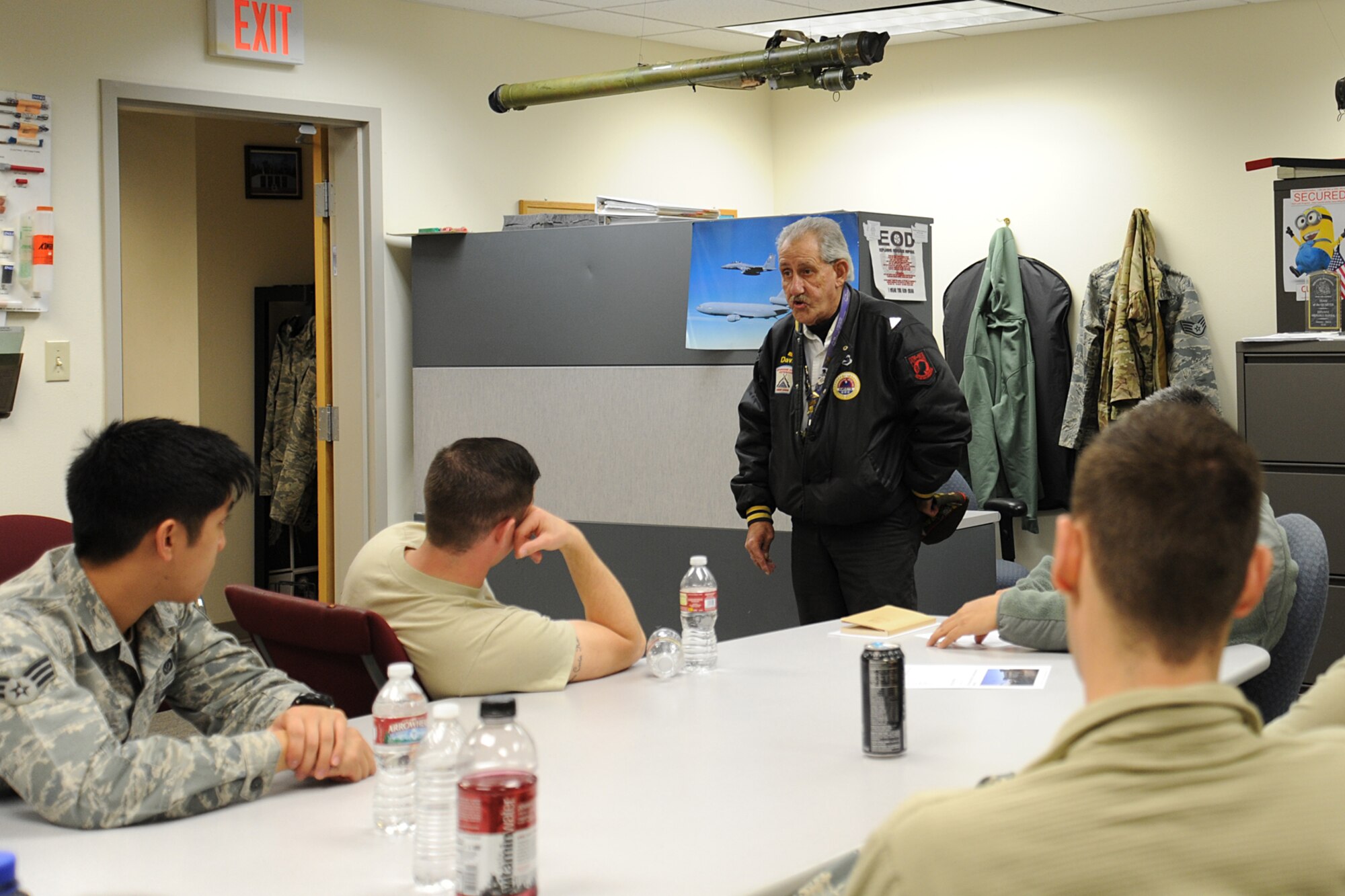 Mr. Jack Davis, a Veterans Affairs representative, briefs Airmen of the 92nd Civil Engineer Squadron’s Explosive Ordnance Disposal flight during their annual safety day at Fairchild Air Force Base, Wash., Nov. 15, 2013. EOD conducted its fifth safety day to raise awareness and inform Airmen of several agencies that are available to them. (U.S. Air Force photo by Airman 1st Class Janelle Patiño/Released)