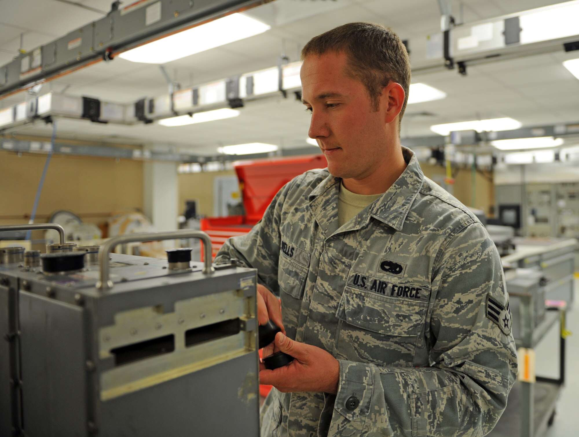 U.S. Air Force Senior Airman James Wells, 7th Component Maintenance Squadron avionics maintenance technician, installs protective caps onto a radar video signal processor Nov. 13, 2013, at Dyess Air Force Base, Texas. A radar video signal processor transmits video signals to the radar target indicator on the B-1B Lancer. Protective caps help prevent debris, static shock and equipment damage during transport. (U.S. Air Force photo by Airman 1st Class Kedesha Pennant/Released)

