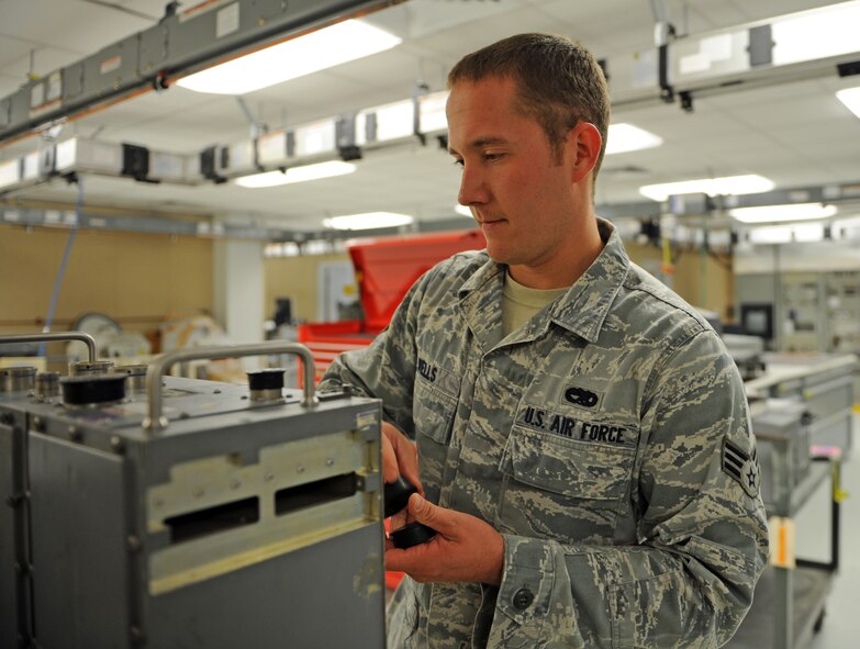 U.S. Air Force Senior Airman James Wells, 7th Component Maintenance Squadron avionics maintenance technician, installs protective caps onto a radar video signal processor Nov. 13, 2013, at Dyess Air Force Base, Texas. A radar video signal processor transmits video signals to the radar target indicator on the B-1B Lancer. Protective caps help prevent debris, static shock and equipment damage during transport. (U.S. Air Force photo by Airman 1st Class Kedesha Pennant/Released)


