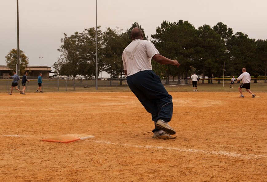 U.S. Air Force Chief Master Sgt. Brian Miller, 23d Mission Support Group chief enlisted manager, rounds first base at Moody Air Force Base, Ga., Nov. 15, 2013. The game went into seven innings with the Chiefs ending the game on top. (U.S. Air Force photo by Airman 1st Class Alexis Grotz/Released)
