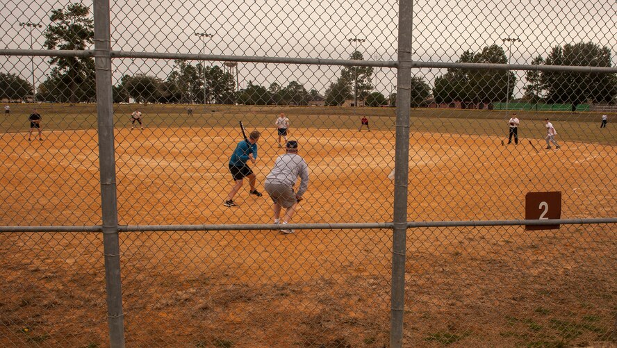A chief master sergeant stands ready for the first bat of the Chiefs vs. Eagles softball game at Moody Air Force Base, Ga., Nov. 15, 2013. The final score for this year left the Chiefs in the winner’s circle with close to 40 runs. (U.S. Air Force photo by Airman 1st Class Alexis Grotz/Released)