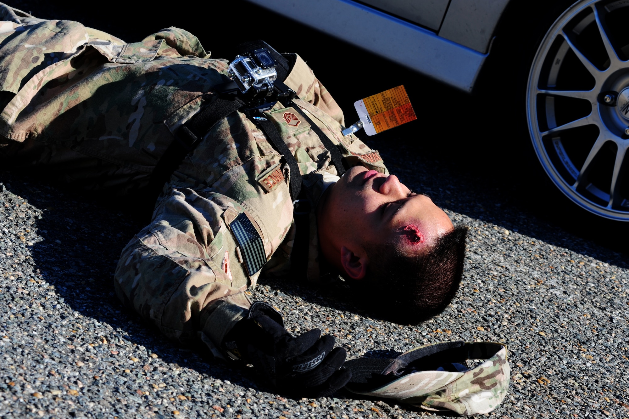 U.S. Air Force Master Sgt. Scott Wagonblott, 633rd Communications Squadron information assurance manager, simulates being a casualty during the active-shooter exercise at Langley Air Force Base, Va., Nov. 19, 2013. The exercise tested the ability of emergency personnel to handle possible threats during everyday operations. (U.S. Air Force photo by Airman Areca T. Wilson/Released)