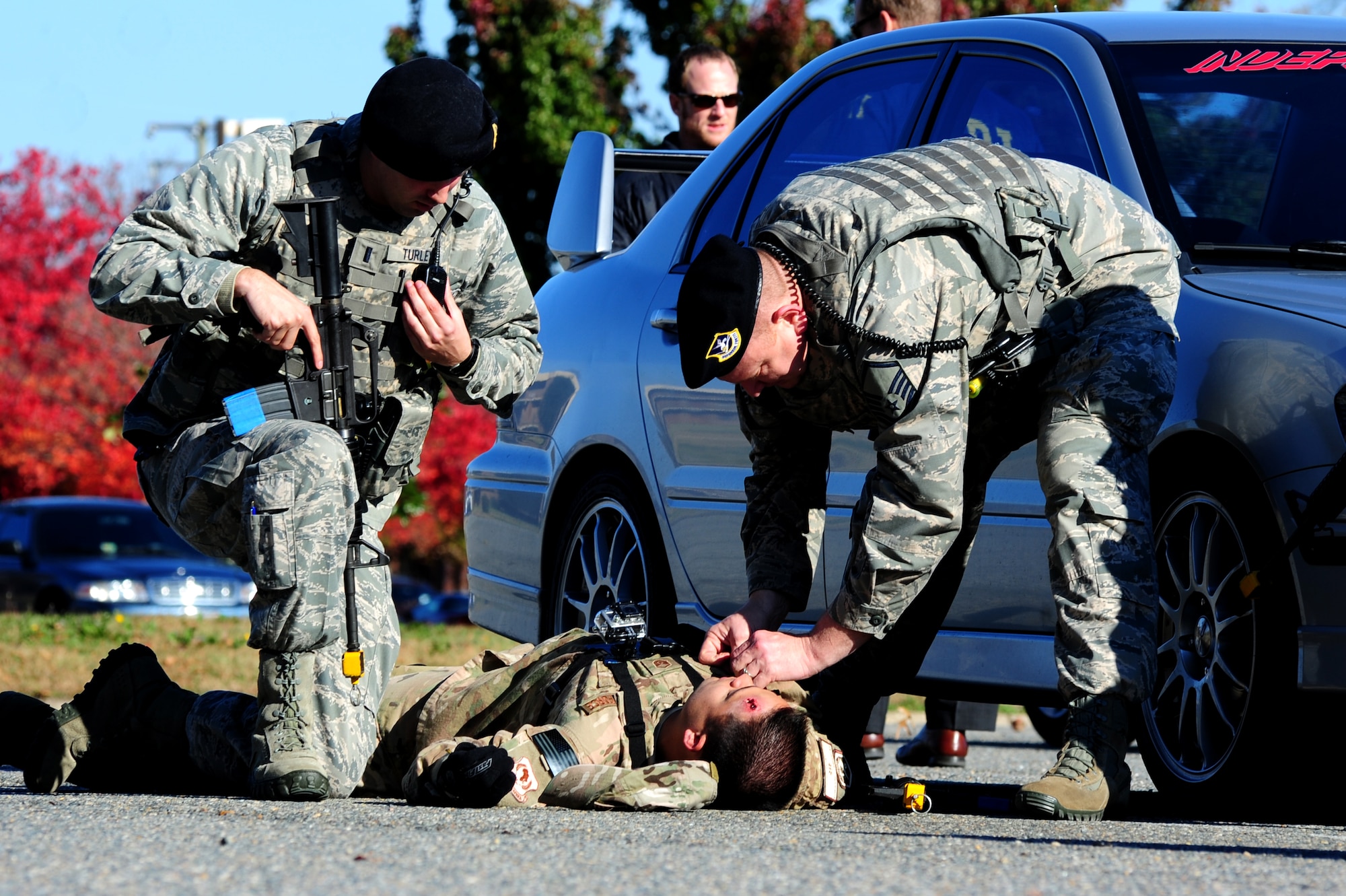 U.S. Air Force Security Forces Airmen simulate the role of first responders during an active-shooter exercise at Langley Air Force Base, Va., Nov. 19, 2013. During certain aspects of the exercise, personnel from Langley Air Force Base worked closely with the city of Hampton to neutralize the active-shooter threat.  (U.S. Air Force photo by Airman Areca T. Wilson/Released)