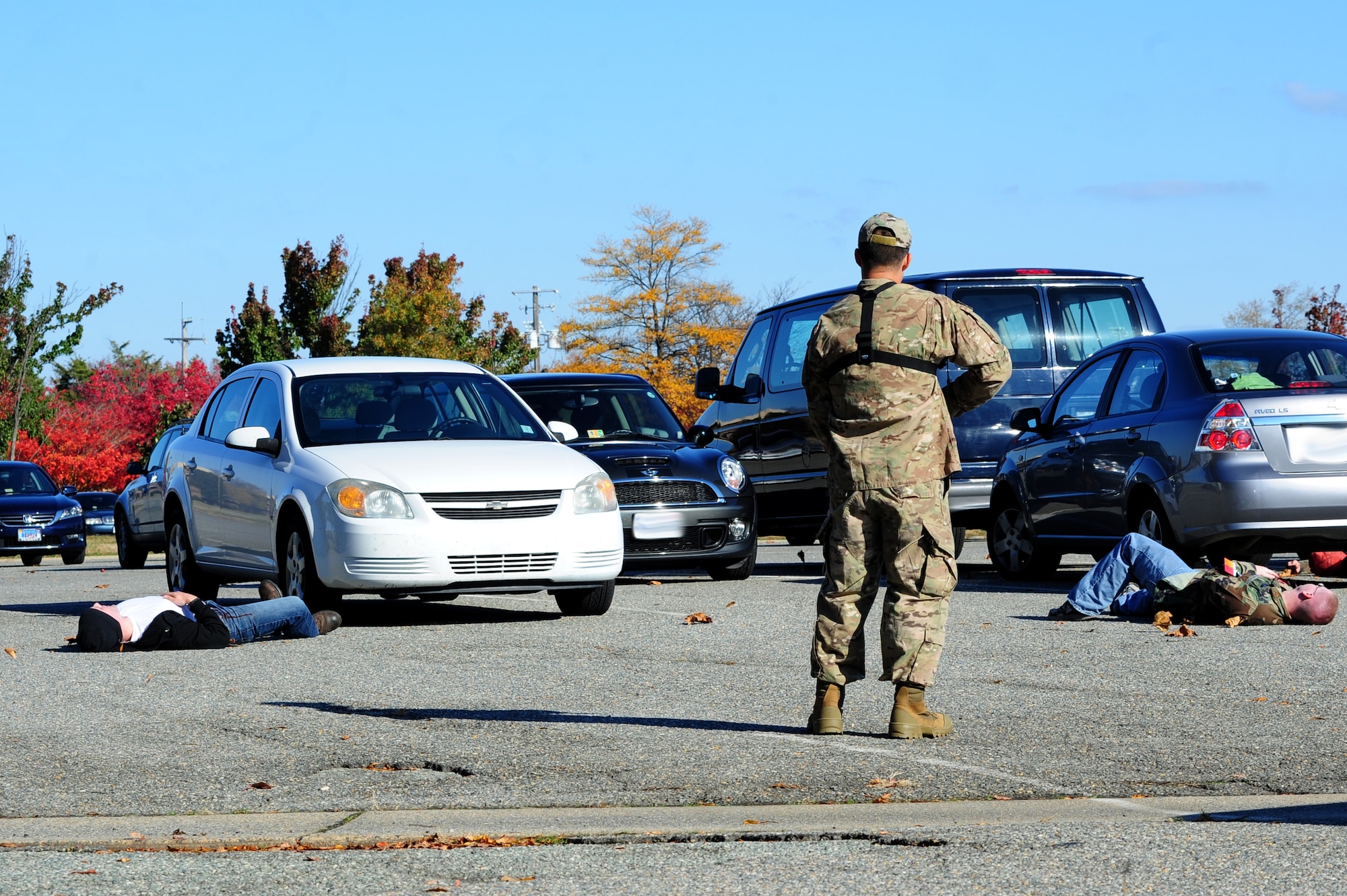 U.S. Air Force Master Sgt. Scott Wagonblott, 633rd Communications Squadron information assurance manager, threatens first responders during an active-shooter exercise at Langley Air Force Base, Va., Nov. 19, 2013. Active-shooter exercises are used to test  the response of units in the event of a real-world emergency. (U.S. Air Force photo by Airman Areca T. Wilson/Released)