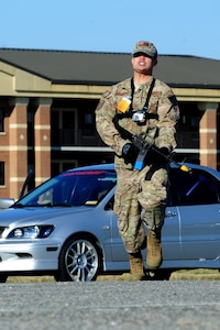 U.S. Air Force Master Sgt. Scott Wagonblott, 633rd Communications Squadron information assurance manager, poses as a simulated active shooter during an exercise at Langley Air Force Base, Va., Nov. 19, 2013. The exercise tested the ability of personnel to handle possible active-shooter threats. (U.S. Air Force photo by Airman Areca T. Wilson/Released)