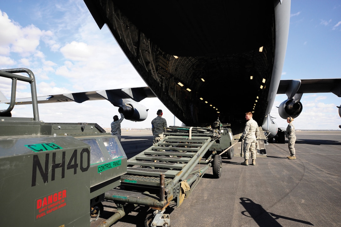 Generators and other flight equipment are loaded on to a C-17 Globemaster by members of the 92d Logistics Readiness Squadron at Grant County International Airport in Moses Lake, Wash.