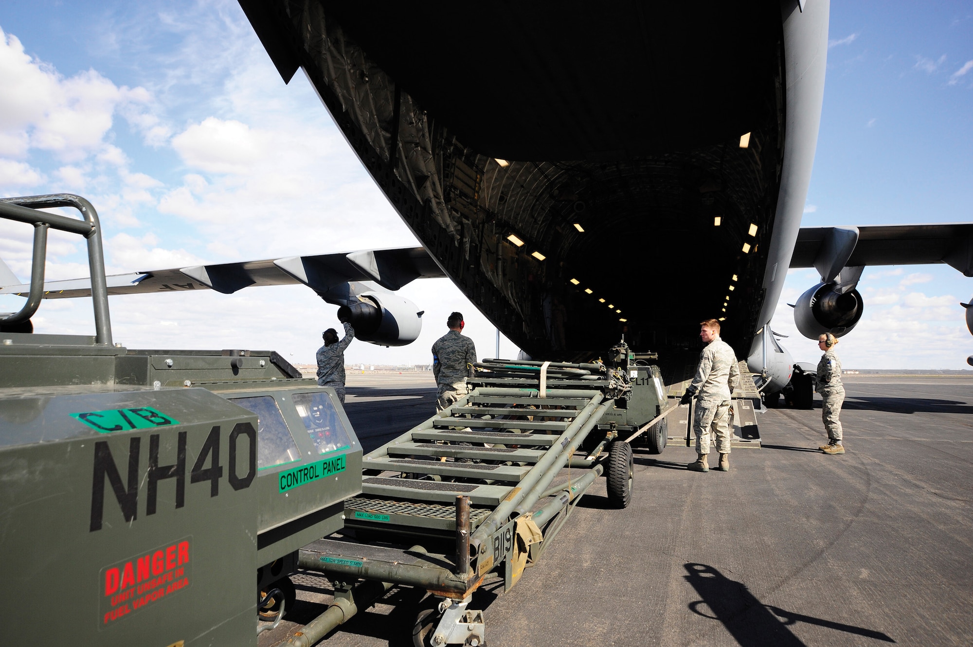 Generators and other flight equipment are loaded on to a C-17 Globemaster by members of the 92d Logistics Readiness Squadron at Grant County International Airport in Moses Lake, Wash.