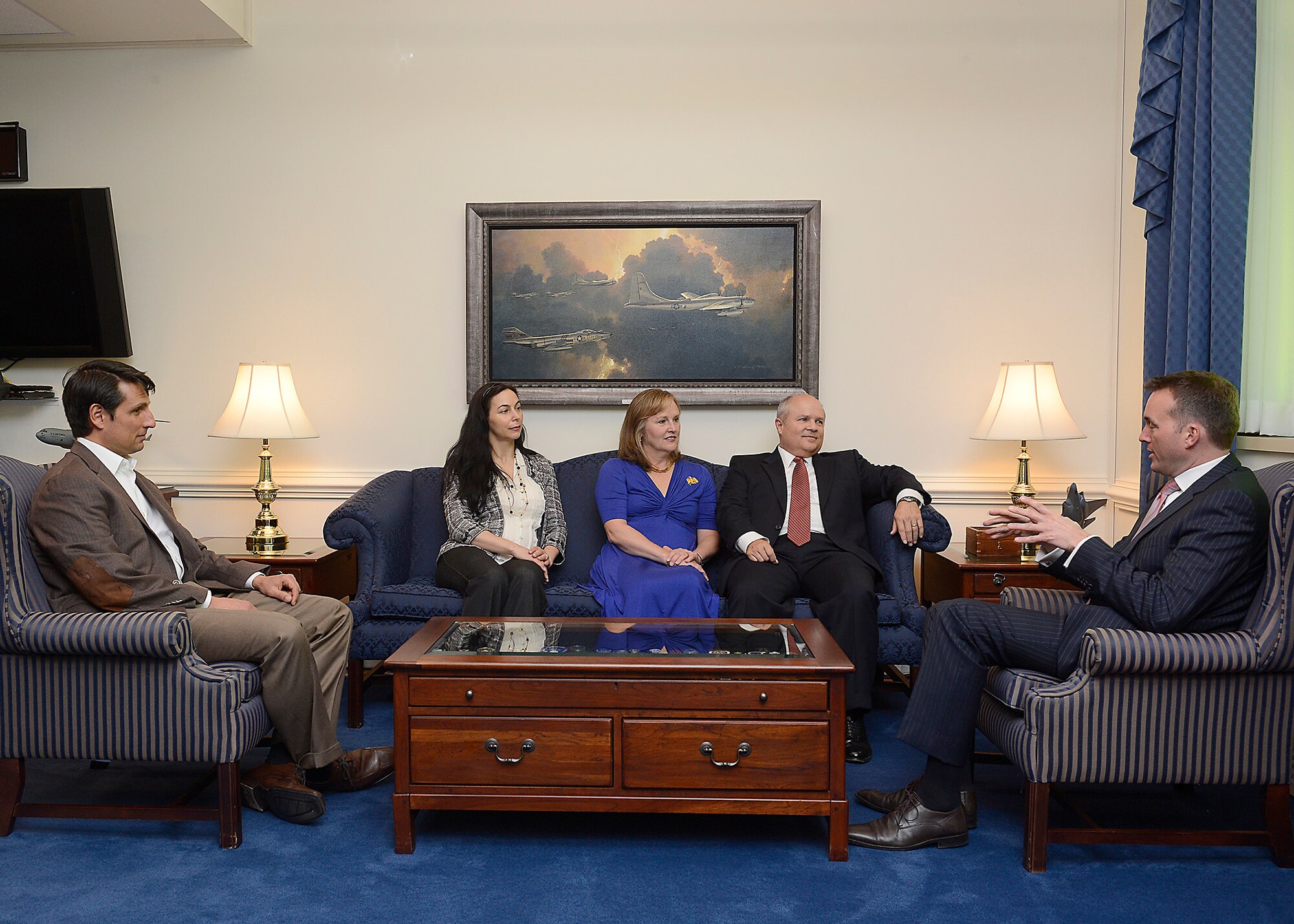 Acting Secretary of the Air Force Eric Fanning (right) visits with retired Maj. Gen. Charles Lyon and his wife, Karen, and Lyon's cousin Robert Foster with his wife, Nadia, before presenting Lyon the Zuckert Management award during a Pentagon ceremony, Nov. 18, 2013. The Zuckert Management Award is named after the seventh secretary of the Air Force and is presented annually to recognize outstanding top-level Air Force managers. (U.S. Air Force photo/Scott M. Ash)
