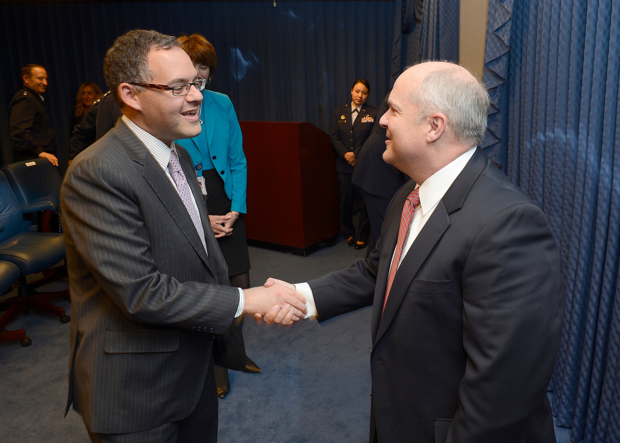 Daniel Ginsberg (left) congratulates retired Maj. Gen. Charles Lyon after Acting Secretary of the Air Force Eric Fanning presented Lyon the Zuckert Management award during a Pentagon ceremony, Nov. 18, 2013. The Zuckert Management Award is named after the seventh secretary of the Air Force and is presented annually to recognize outstanding top-level Air Force managers. Ginsberg is the assistant secretary of the Air Force for Manpower and Reserves. (U.S. Air Force photo/Scott M. Ash)
