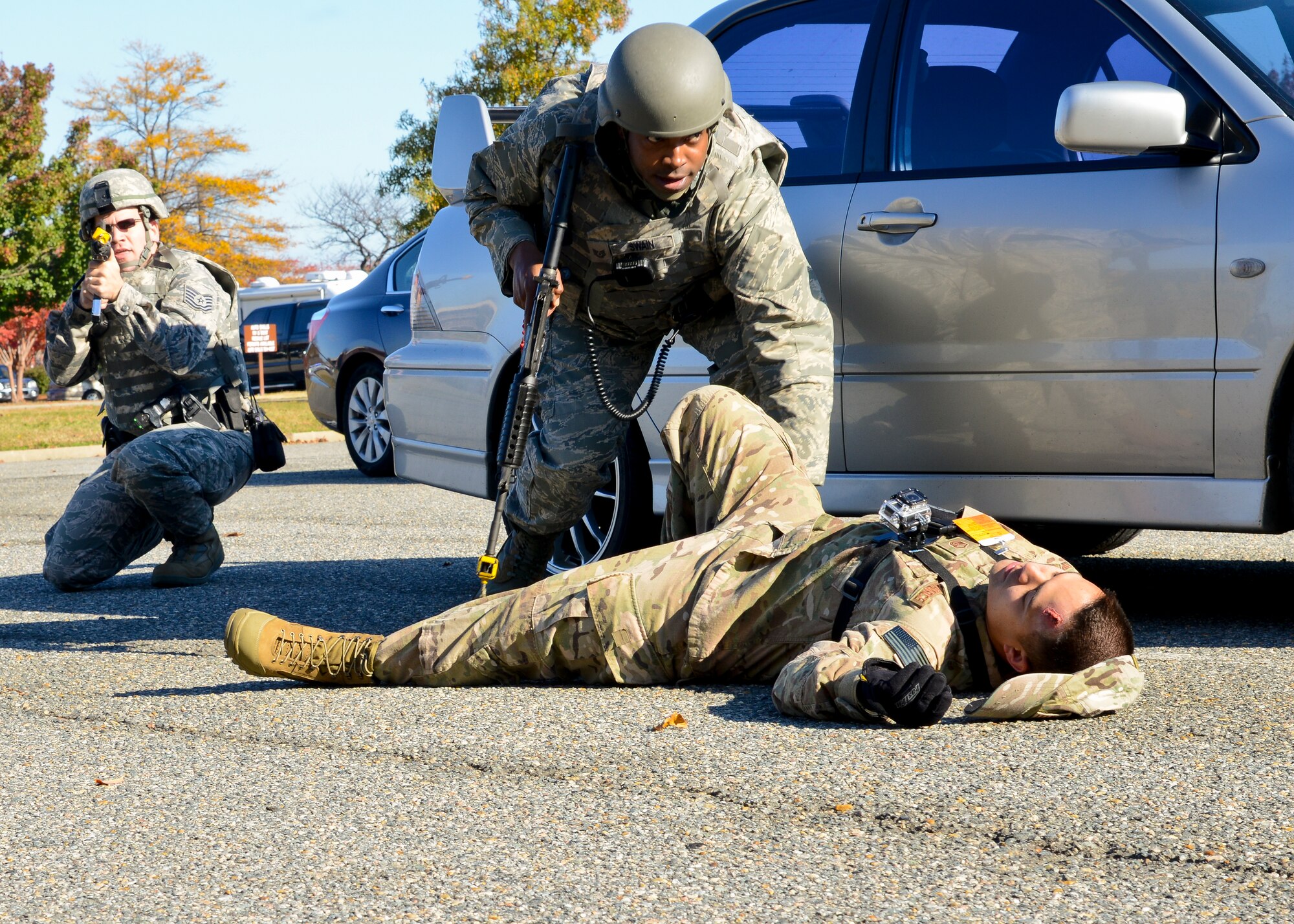 U.S. Air Force Airmen from the 633rd Security Forces Squadron participate an active-shooter exercise at Langley Air Force Base, Va., Nov. 19, 2013. The 633rd SFS and the Hampton Police Department worked hand-in-hand during aspects of the exercise to ensure it prepared Langley personnel for an emergency situation. (U.S. Air Force photo by Airman 1st Class Victoria H. Taylor/Released)