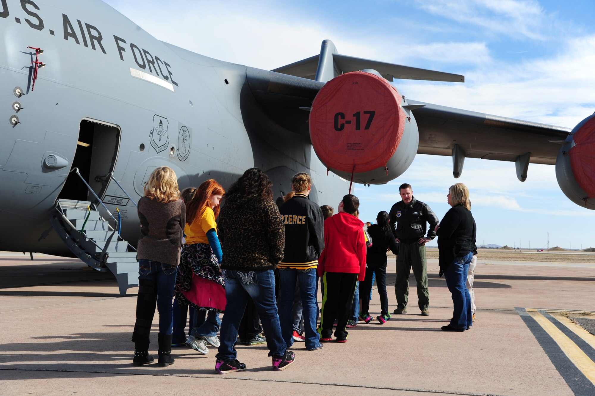 ALTUS AIR FORCE BASE, Okla. -- Fifth-grade students from the Burns Flat STARBASE Classroom prepare to tour a U.S. Air Force C-17 Globemaster III cargo aircraft during Career Day Nov. 18, 2013. The students also toured a KC-135 Stratotanker refueler and various base agencies to learn how science, technology, engineering and math are applied to jobs in the military. The STARBASE program aims to motivate students to explore STEM as they continue their education.  (U.S. Air Force photo by Senior Airman Lausanne Genuino/Released)