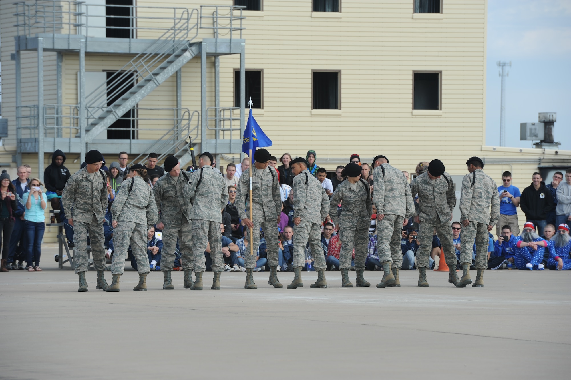 GOODFELLOW AIR FORCE BASE, Texas -- The 315th Training Squadron drill team inspect each other as part of their exhibition drill during the 17th Training Group’s quarterly drill competition at the 5th Annual Goodfellow Community Appreciation Day at the Louis F. Garland Department of Defense Fire Academy Nov. 16. The competition included regulation drill, exhibition drills and “knock out;” a military version of “Simon Says.” (U.S. Air Force photo/ Staff Sgt. Laura R. McFarlane)