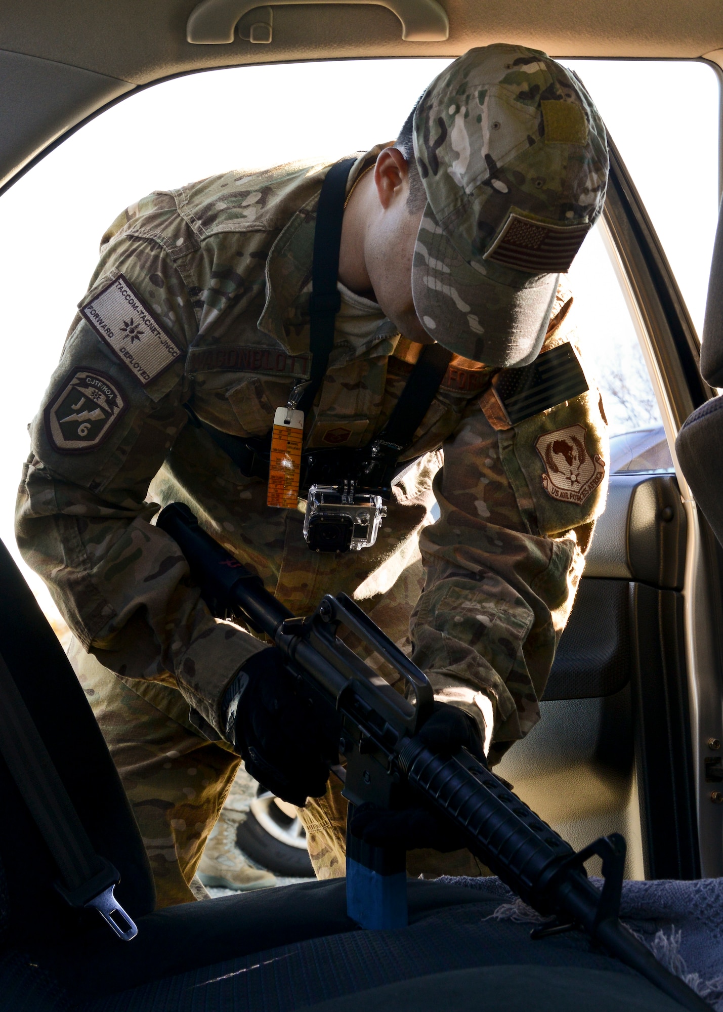 U.S. Air Force Master Sgt. Scott Wagonblott, 633rd Communications Squadron information assurance manager, grabs a simulated weapon during an active-shooter exercise at Langley Air Force Base, Va., Nov. 19, 2013. During the exercise, Wagonblott portrayed a distressed Airman to test Langley Airmen’s emergency-response procedures. (U.S. Air Force photo by Airman 1st Class Victoria H. Taylor/Released)