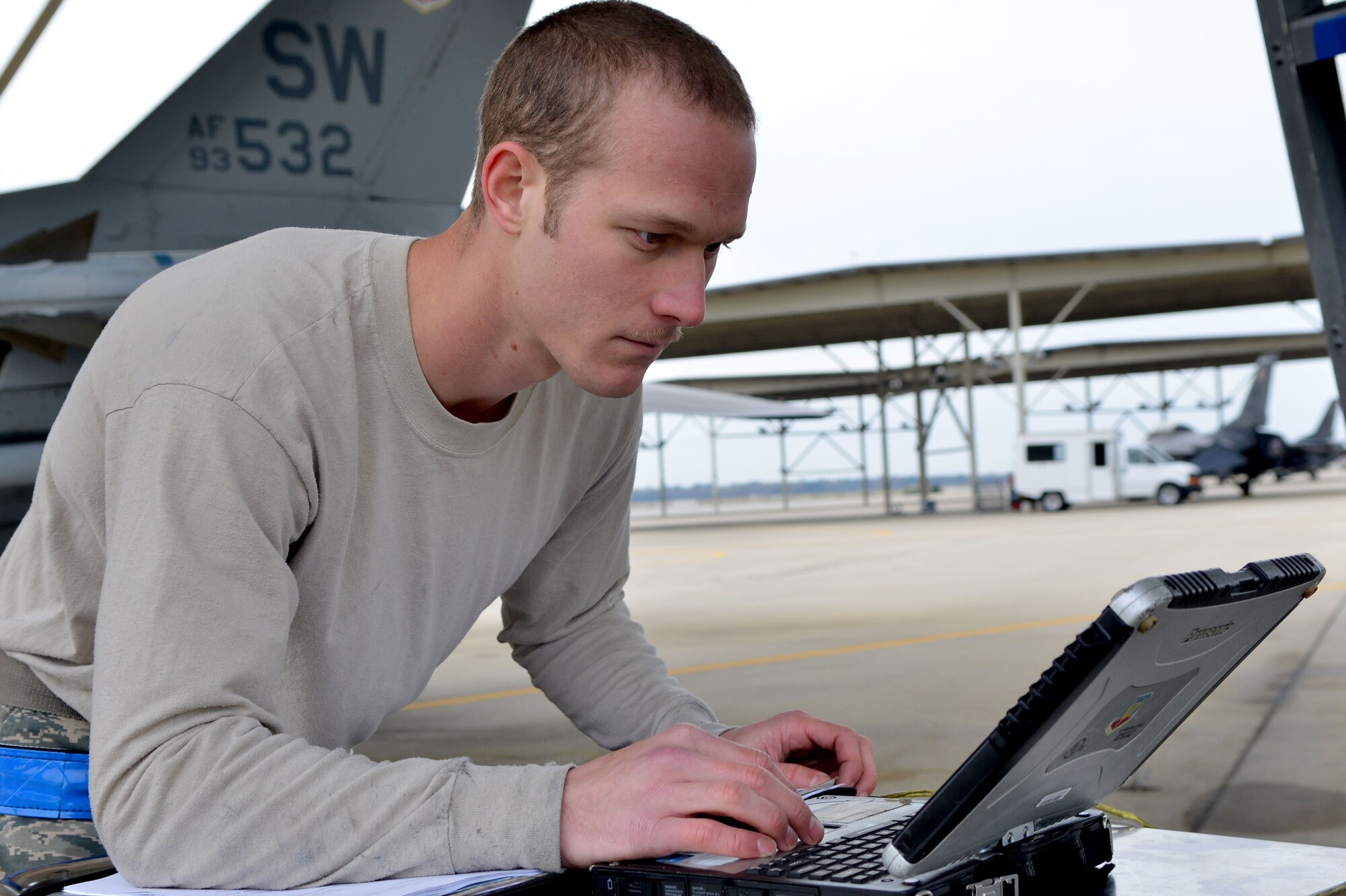 U.S. Air Force Senior Airman Matthew Hollenback, 20th Aircraft Maintenance Squadron tactical aircraft maintainer, goes through his maintenance checklist, Shaw Air Force Base, S.C., Nov. 15, 2013. Maintainers at Shaw work day and night to keep the F-16 Fighting Falcons mission ready for combat ready airpower and Airmen at all times. (U.S. Air Force photo by Airman 1st Class Ashley L. Gardner/Released)