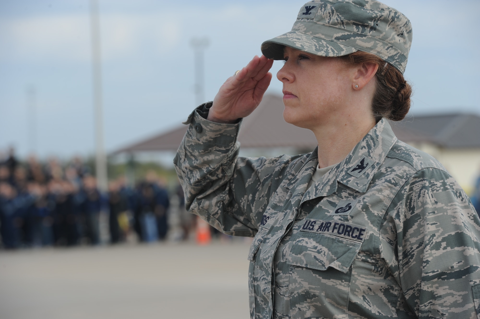 GOODFELLOW AIR FORCE BASE, Texas -- Col. Kimberlee Joos, 17th Training Wing Commander, salutes for the singing of the national anthem during the 17th Training Group’s quarterly drill competition at the 33rd Annual Goodfellow Community Appreciation Day at the Louis F. Garland Department of Defense Fire Academy Nov. 16. Other events throughout the day included Army Operations in Urban Terrain, Aircraft Fire and more. (U.S. Air Force photo/ Staff Sgt. Laura R. McFarlane)