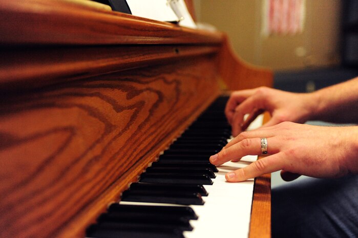 Adam Hallam, Doris French Elementary School music teacher, plays “God Bless America” on his piano as the school choir sings during a Veterans Day assembly at Doris French Elementary School in Las Vegas. Nov. 8, 2013. During the assembly, veterans and active duty military members watched various patriotic performances by the school’s kindergarten through fifth grade choir and band. (U.S. Air Force photo by Airman 1st Class Joshua Kleinholz)