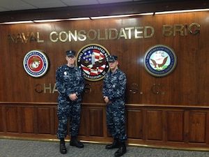 Petty Officer 1st Class Ian Wakefield, a Religious Program Specialist (left), and Petty Officer 2nd Class Michael McNeil, an Operations Specialist, have been named the Naval Consolidated Brig Charleston’s 2013 Sailor and Junior Sailor of the Year. 