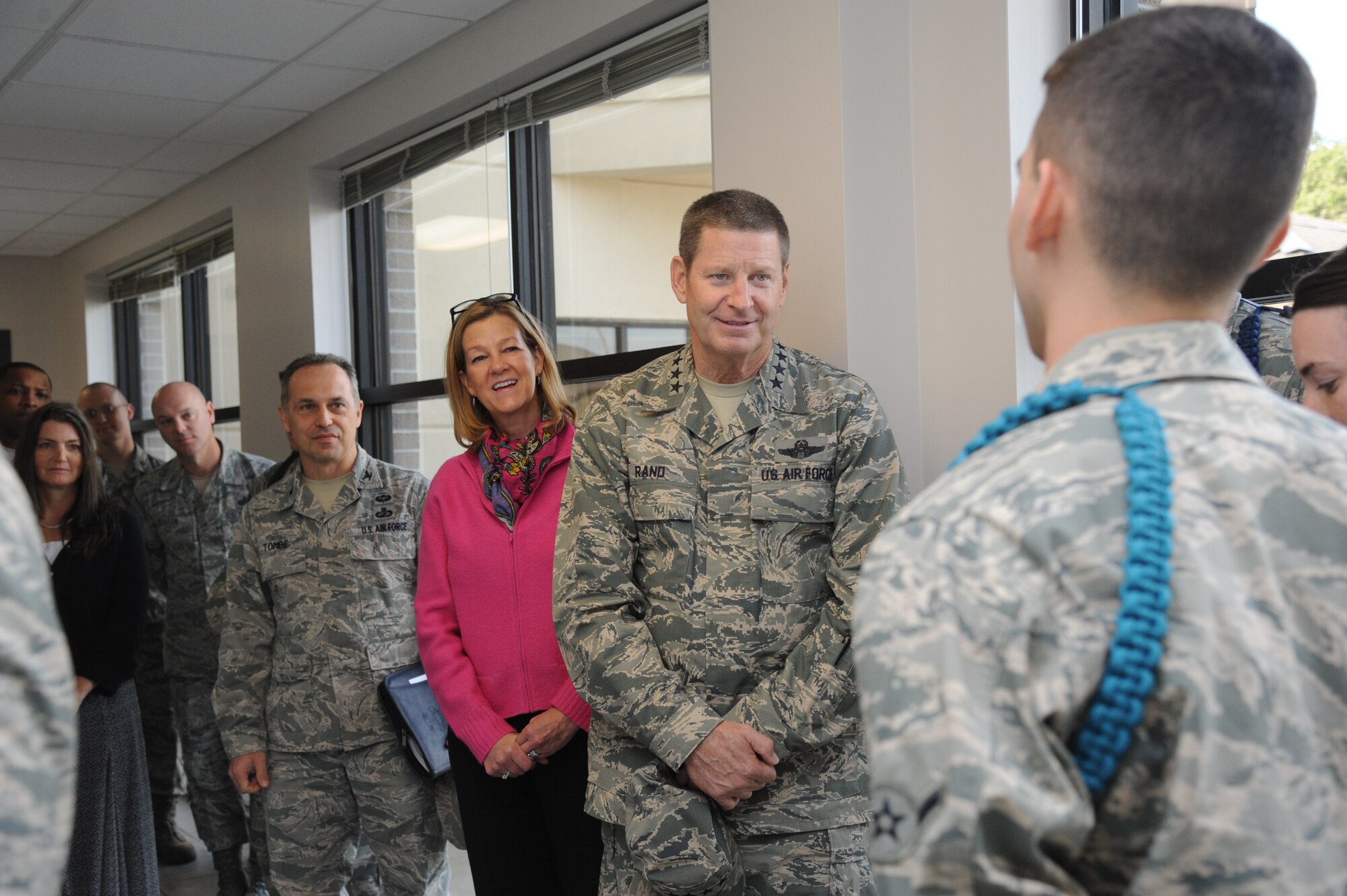 Gen. Robin Rand, Air Education and Training Command commander, and his wife, speak to Airman Angel De Jesus Rios, 336th Training Squadron, about the teal rope program Nov. 14, 2013, at the Levitow Training Support Facility, Keesler Air Force Base, Miss. During a visit to Keesler, Rand was accompanied by his wife and Chief Master Sgt. Gerardo Tapia, AETC command chief.  The visit also included three commander’s calls, and a tour of the Keesler Medical Center and 2nd Air Force headquarters. (U.S. Air Force photo by Kemberly Groue)