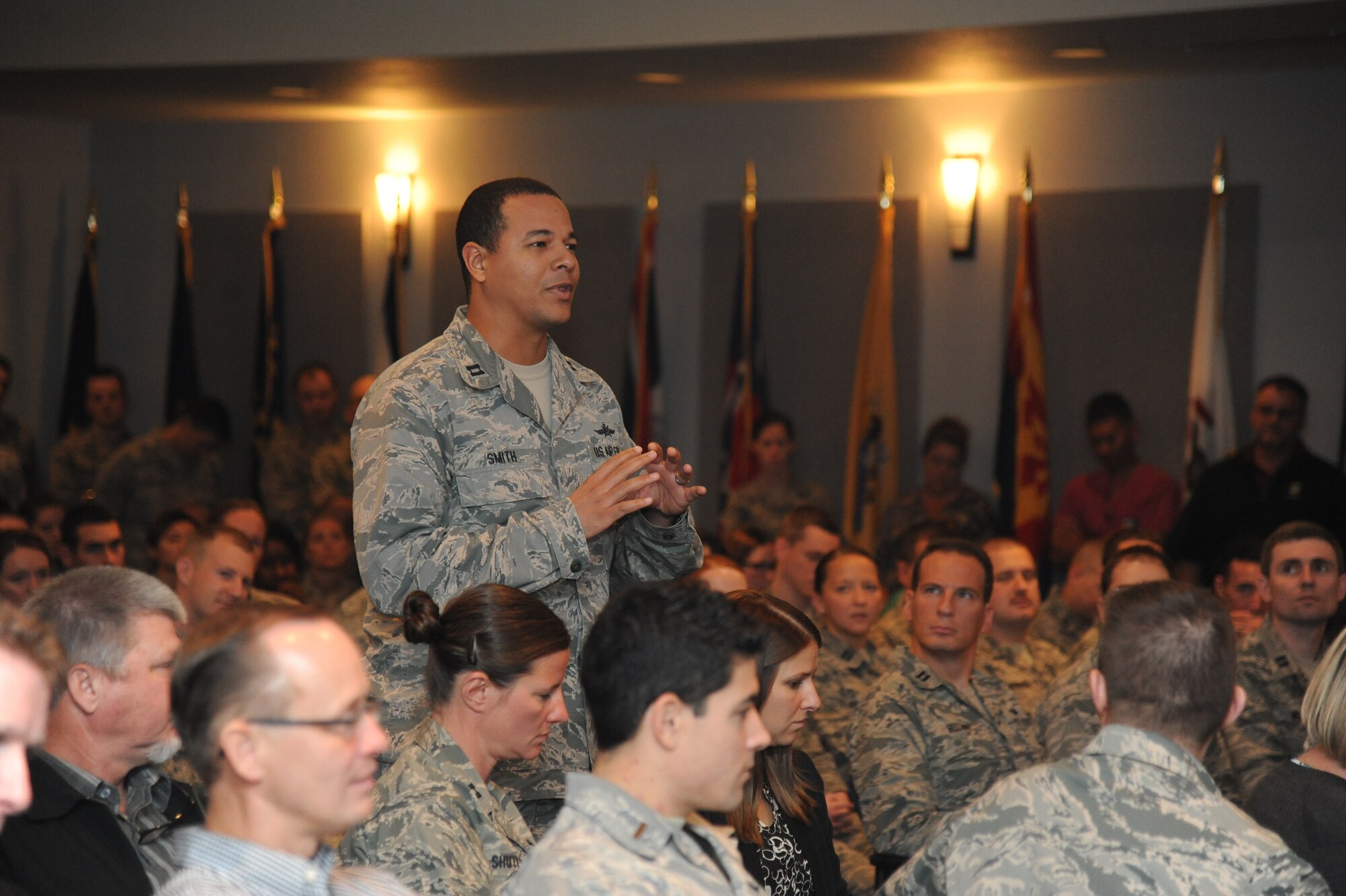 Capt. Johnny Smith, 338th Training Squadron, asks a question to Gen. Robin Rand, Air Education and Training Command commander, during a commander’s call for Keesler Company Grade Officers and civilians during a visit to Keesler Nov. 13-14, 2013, at the Keesler Medical Center, Keesler Air Force Base, Miss.  Rand was accompanied by his wife and Chief Master Sgt. Gerardo Tapia, AETC command chief.  The visit also included a tour of the 81st Medical Group, the Levitow Training Support Facility and 2nd Air Force headquarters. (U.S. Air Force photo by Kemberly Groue)
