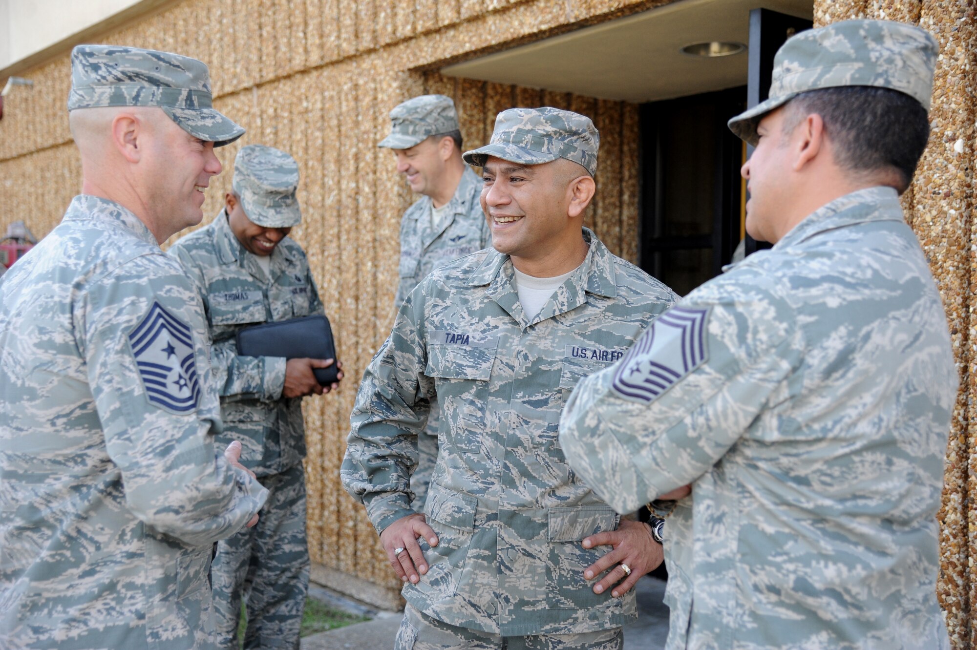 Chief Master Sgt. Gerardo Tapia, Air Education and Training Command command chief, speaks with Chief Master Sgts. David Staton, 2nd Air Force command chief, and Eleizer Santos, 81st Training Support Squadron, during a site visit to Keesler Nov. 13-14, 2013, at the Keesler Medical Center, Keesler Air Force Base, Miss. Tapia accompanied Gen. Robin Rand, AETC commander, and Mrs. Rand to Keesler during a visit which also included three commander’s calls, and a tour of the 81st Medical Group, the Levitow Training Support Facility and 2nd Air Force headquarters. (U.S. Air Force photo by Kemberly Groue)