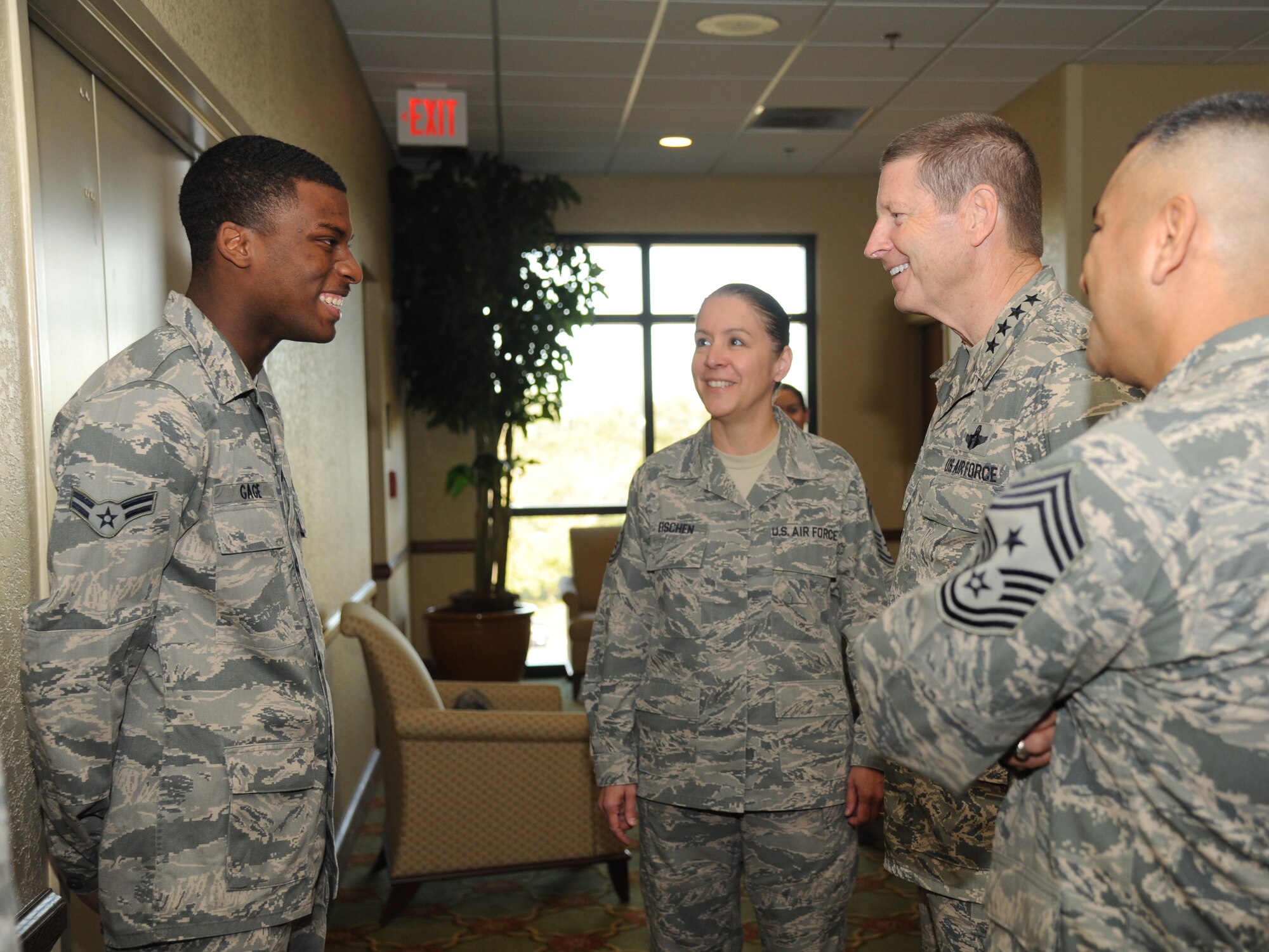 Airman 1st Class Cory Gage, 81st Diagnostic and Therapeutics Squadron, is introduced by Chief Master Sgt. Paula Eischen, 81st Medical Group, to Gen. Robin Rand, Air Education and Training Command commander, and Chief Master Sgt. Gerardo Tapia, AETC command chief, as he is recognized for his hard work and dedication Nov. 14, 2013, at the Bay Breeze Event Center, Keesler Air Force Base, Miss.  The visit to Keesler by Rand and Tapia included three commander’s calls, a tour of the 81st Medical Group, the Levitow Training Support Facility and 2nd Air Force headquarters. (U.S. Air Force photo by Kemberly Groue)