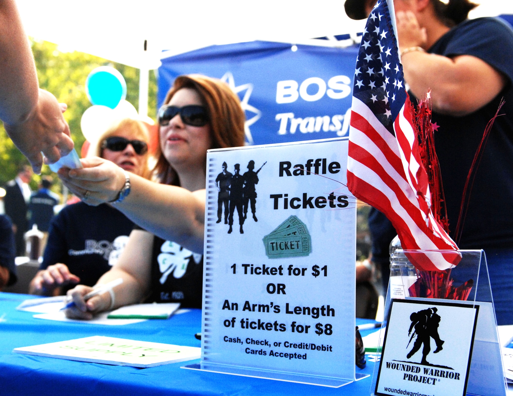 More than 50 local business employees supported the Wounded Warriors Barbecue in Newport News, Va., Oct. 4, 2013. Overall, the barbecue raised $10,000 in support of the Wounded Warriors Project. (U.S. Air Force photo by 2nd Lt. Brooke Betit/Released)