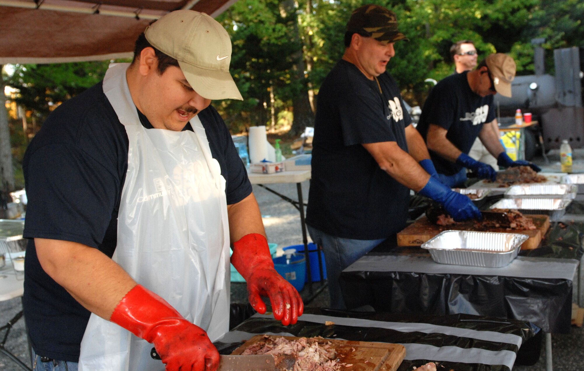 The third annual Wounded Warriors Barbecue, held in Newport News, Va., Oct. 4, 2013, raised money to support the Wounded Warriors Project. More than 90 individuals from Langley Air Force Base and local businesses volunteered to cook, serve food and pass out information at the event.  (U.S. Air Force photo by 2nd Lt. Brooke Betit/Released)