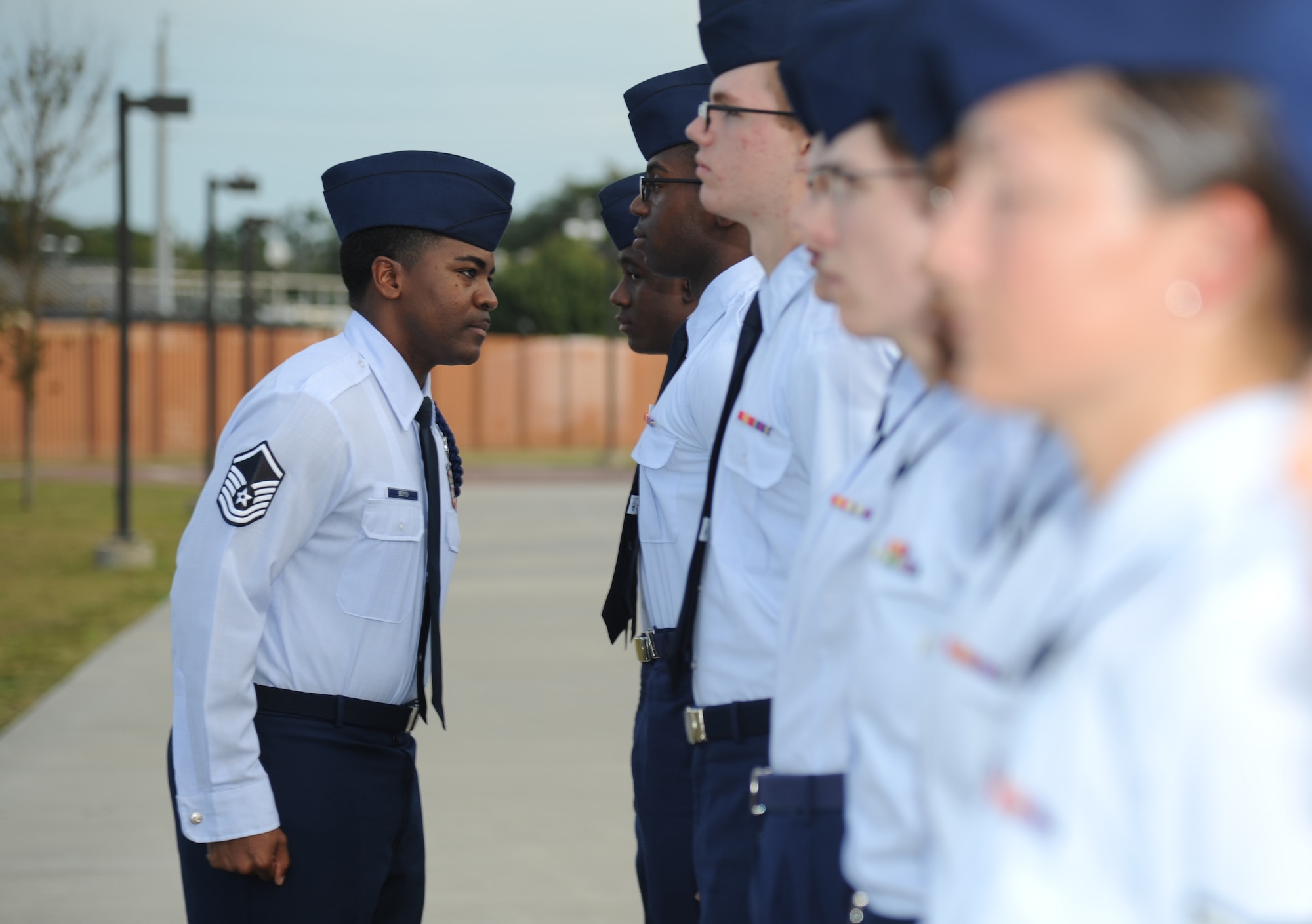 Master Sgt. Terrance Boyd, 334th Training Squadron flight chief military training flight, conducts an open ranks inspection on Airmen Nov. 18, 2013, at Avery Manor, Keesler Air Force Base, Miss.  Boyd was recently selected as the 2013 Air Education and Training Command junior enlisted category Lance P. Sijan award winner.  (U.S. Air Force photo by Kemberly Groue)