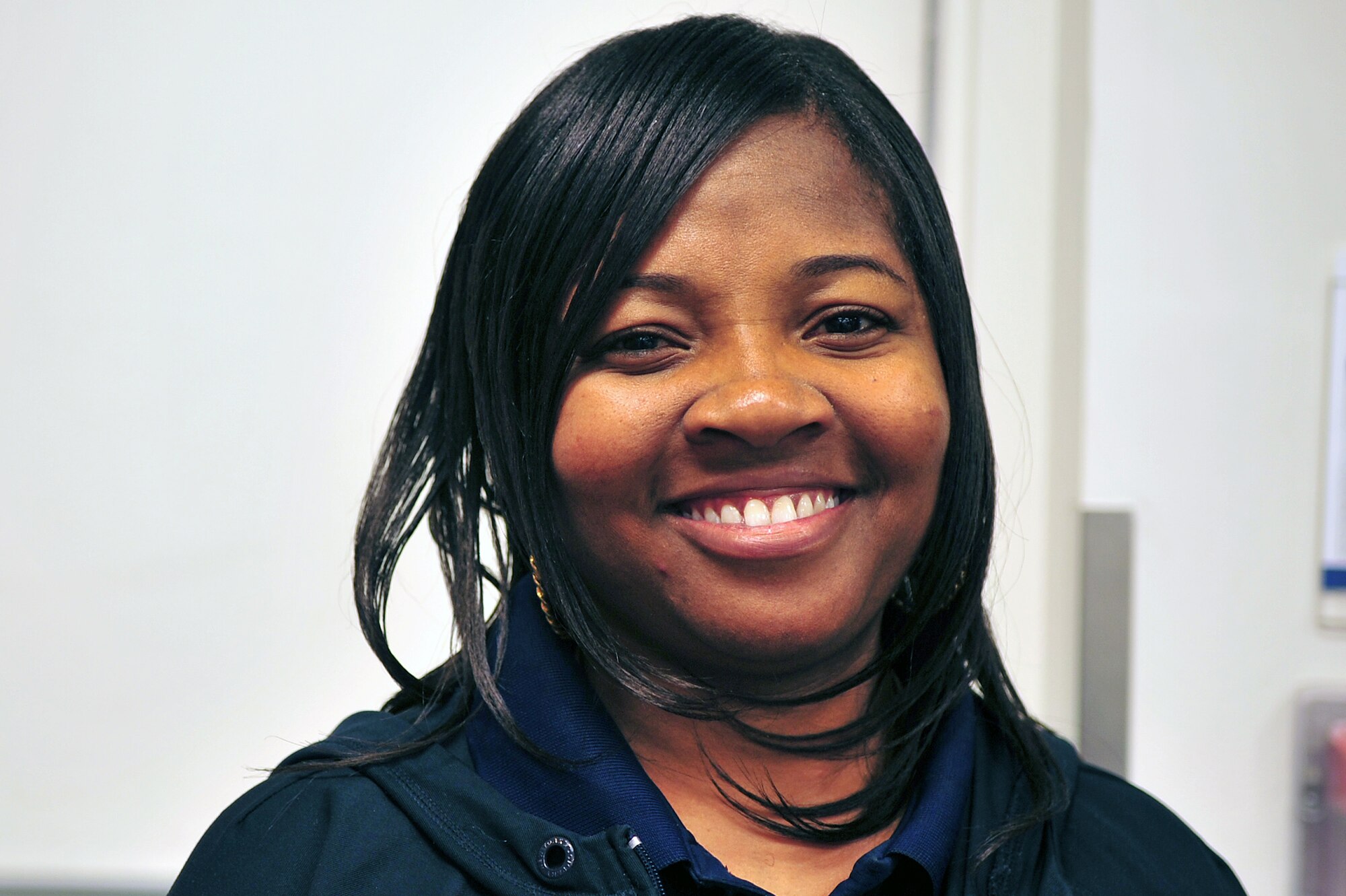 Keiana Taylor, Base Exchange senior sales associate, works at Seymour Johnson Air Force Base, N.C., Nov. 15, 2013. Taylor said she is grateful for family, friends, a place to live and her job. (U.S. Air Force photo by Airman 1st Class Shawna Keyes)