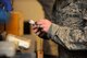 U.S. Air Force Senior Airman Eric Blanton, 7th Operations Support Squadron, removes the diffuser plug from a carbon dioxide bottle prior to weighing it  Nov. 18, 2013, at Dyess Air Force Base, Texas. Blanton is able to keep working despite being dignosed with type-one diabeties. Diabetics do not naturally produce insulin and the body becomes  dependent on insulin supplementation. (U.S. Air Force photo by Airman 1st Class Autumn Velez/Released)