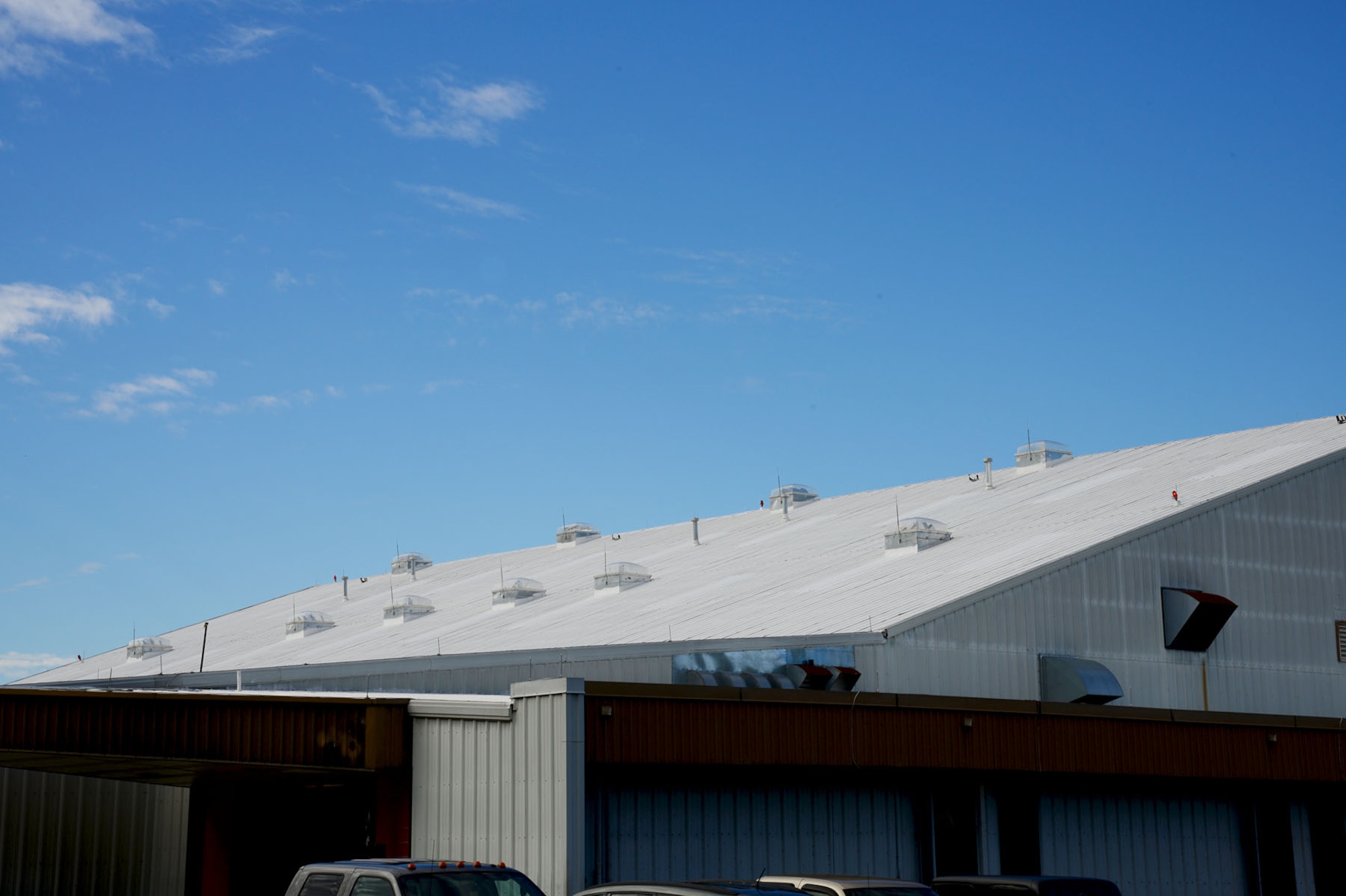 Solar-tracking skylights are seen installed in the roof of hangar 2418 at Fort Eustis, Va., Nov. 18, 2013. The skylights save energy by using the sun as a power source to track its movement, which enables Soldiers to utilize only the illumination from the sun through the skylight as a source of lighting throughout the day. (U.S. Air Force photo by Staff Sgt. Ashley Hawkins/Released)