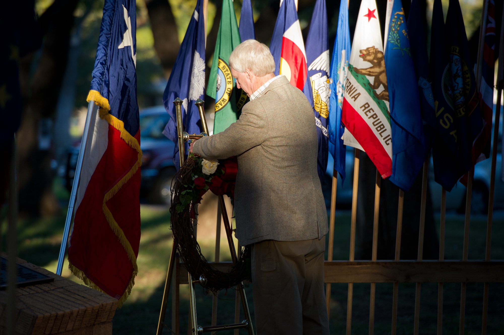 SAN ANGELO, Texas -- Joe Conelison, a Vietnam veteran, lays a wreath at the Oak Grove Memorial during the candlelight vigil opening ceremony portion of the Veterans’ Vigil at Angelo State University Nov. 13. The wreath was laid in remembrance of Sept. 11, 2001. (U.S. Air Force photo/ Staff Sgt. Laura R. McFarlane)
