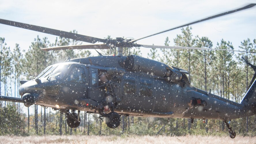 U.S. Air Force Maj. Gen. Jake Polumbo, Ninth Air Force commander, engages in a combat search and rescue task force training exercise near Valdosta, Ga., Nov. 13, 2013. The exercise was part of a visit by the 9th AF commander and command chief to Moody Air Force Base.(U.S. Air Force photo by Airman Dillian Bamman/Released)
