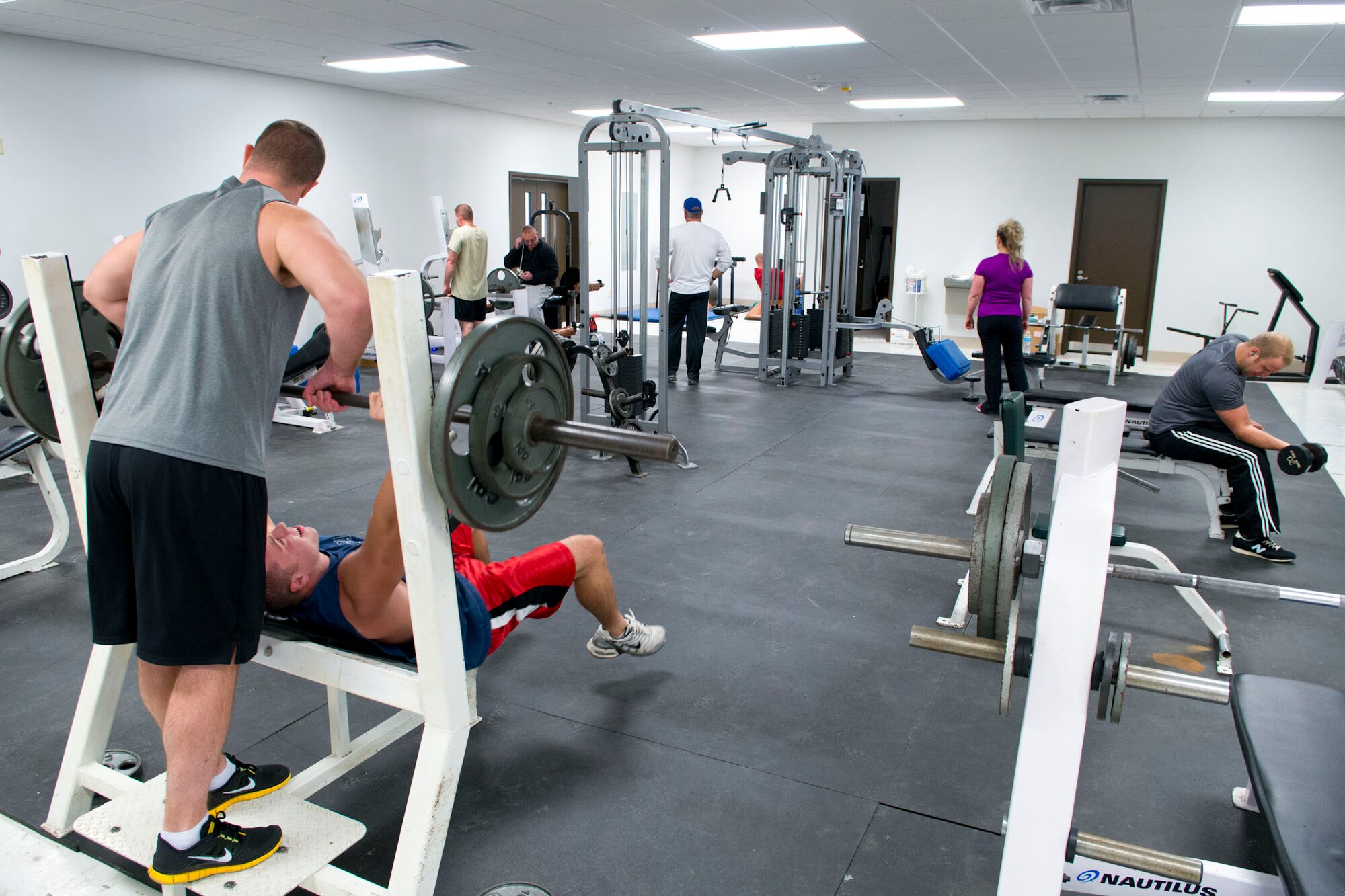 Airmen take advantage of the new fitness room located in building 119 at the 167th Airlfit Wing. The facility has more room than the previous fitness area and new equipment has been added. (Air National Guard photo by Master Sgt. Emily Beightol-Deyerle)