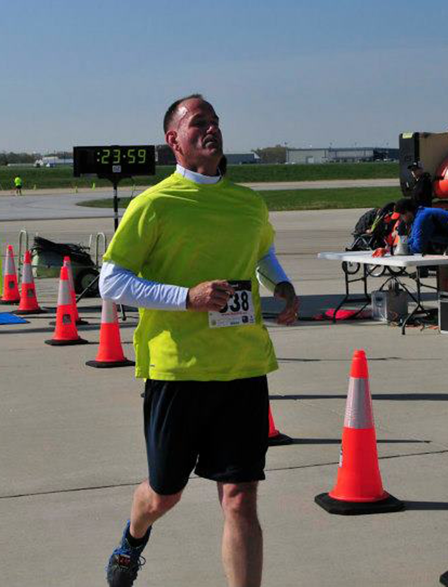 Senior Master Sgt. Dave Stevens crosses the finish line at the C-5 K Fun Run at the 167th Airlift Wing, April 27, 2013. Running became an integral part of Stevens' quest for a healthier lifestyle. (Air National Guard photo by Tech. Sgt. Robert Fluharty)
